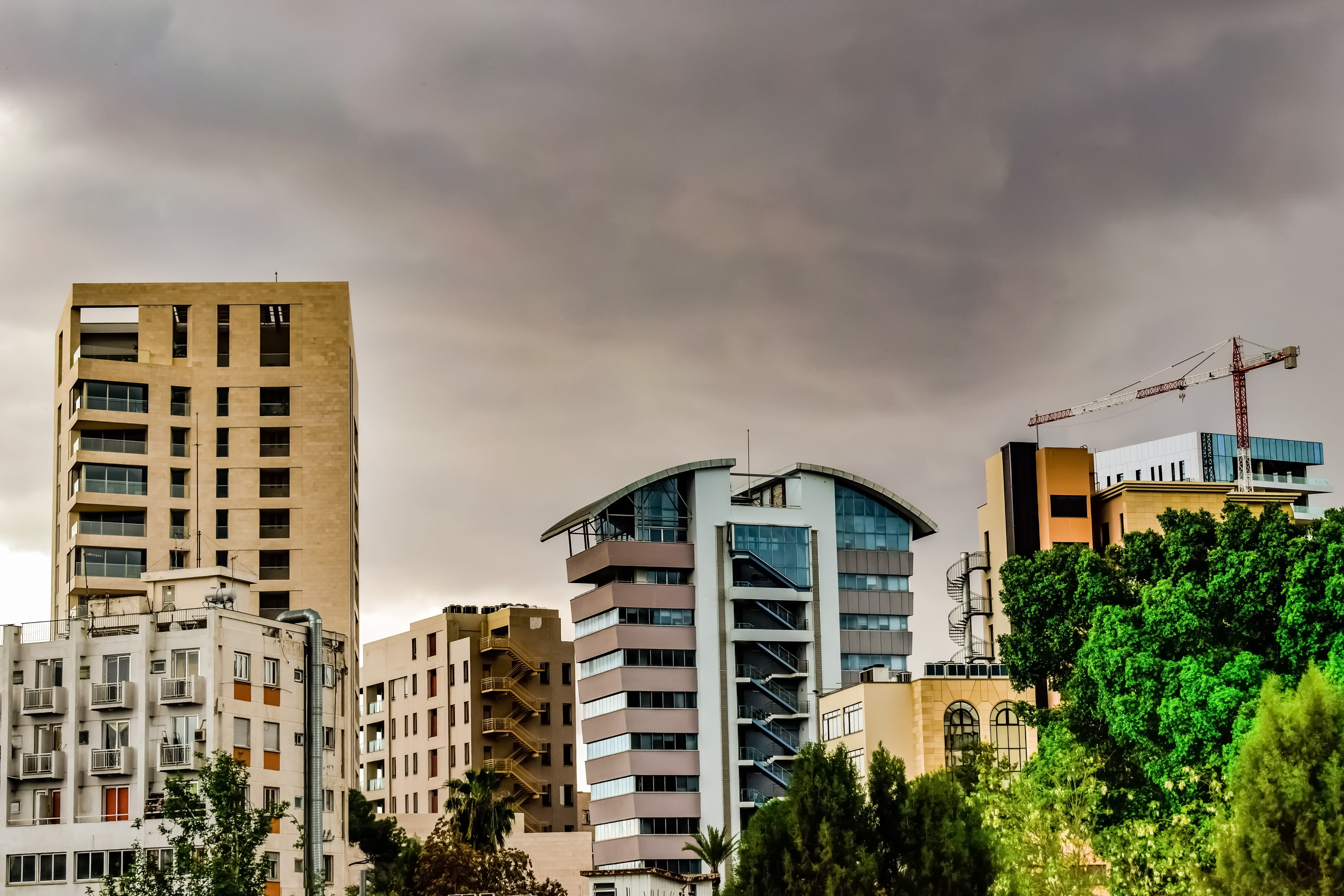 urban, architecture, built structure, cloudy, low angle view, stormy, lefkosia, residential district, outdoors, cloud - sky, window, sunset, modern, skyline, HD Wallpaper