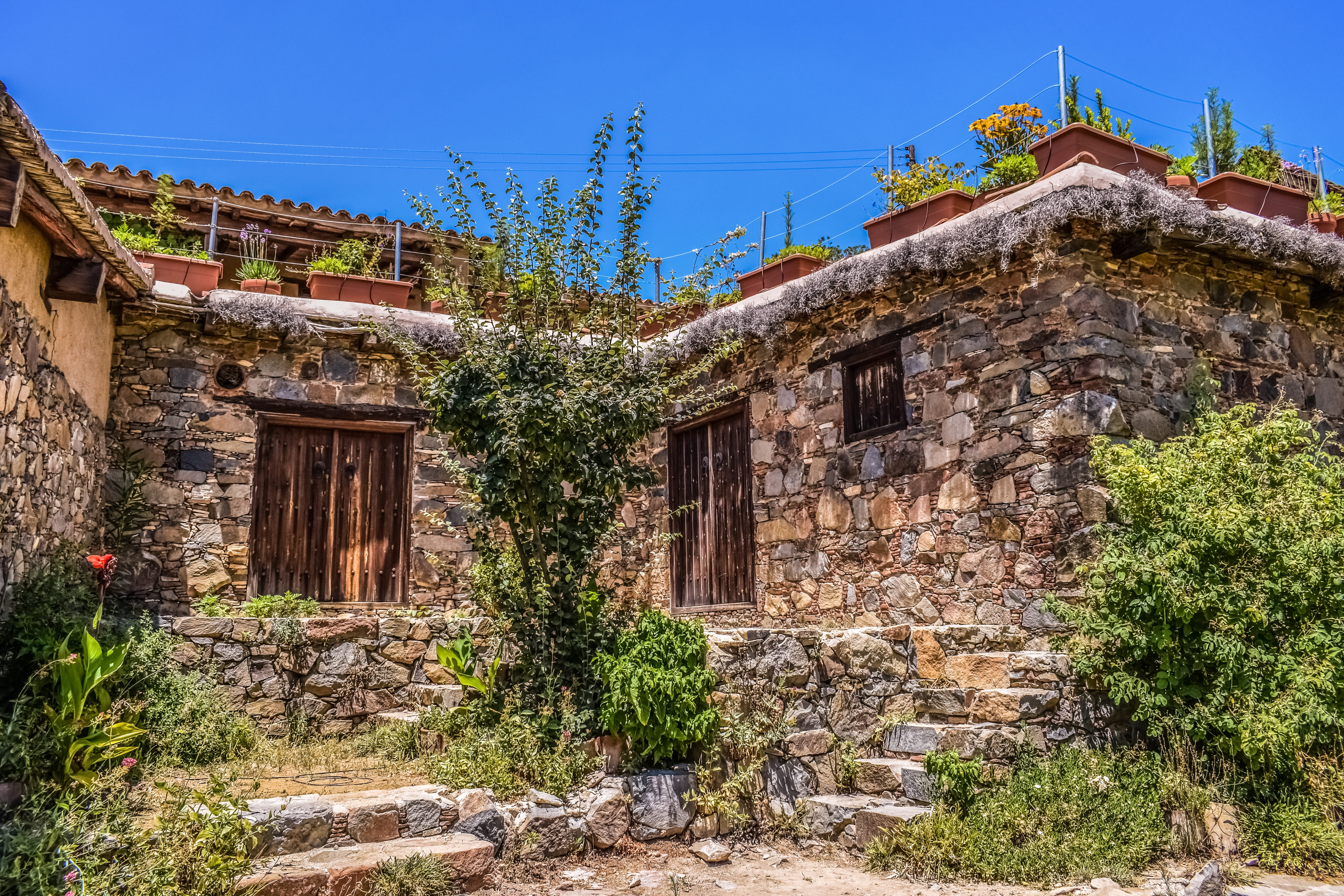 house, village, outdoors, plant, built structure, sky, community, unesco world heritage, stone wall, building exterior, blue, tree, nature, deserted, 5K, HD Wallpaper