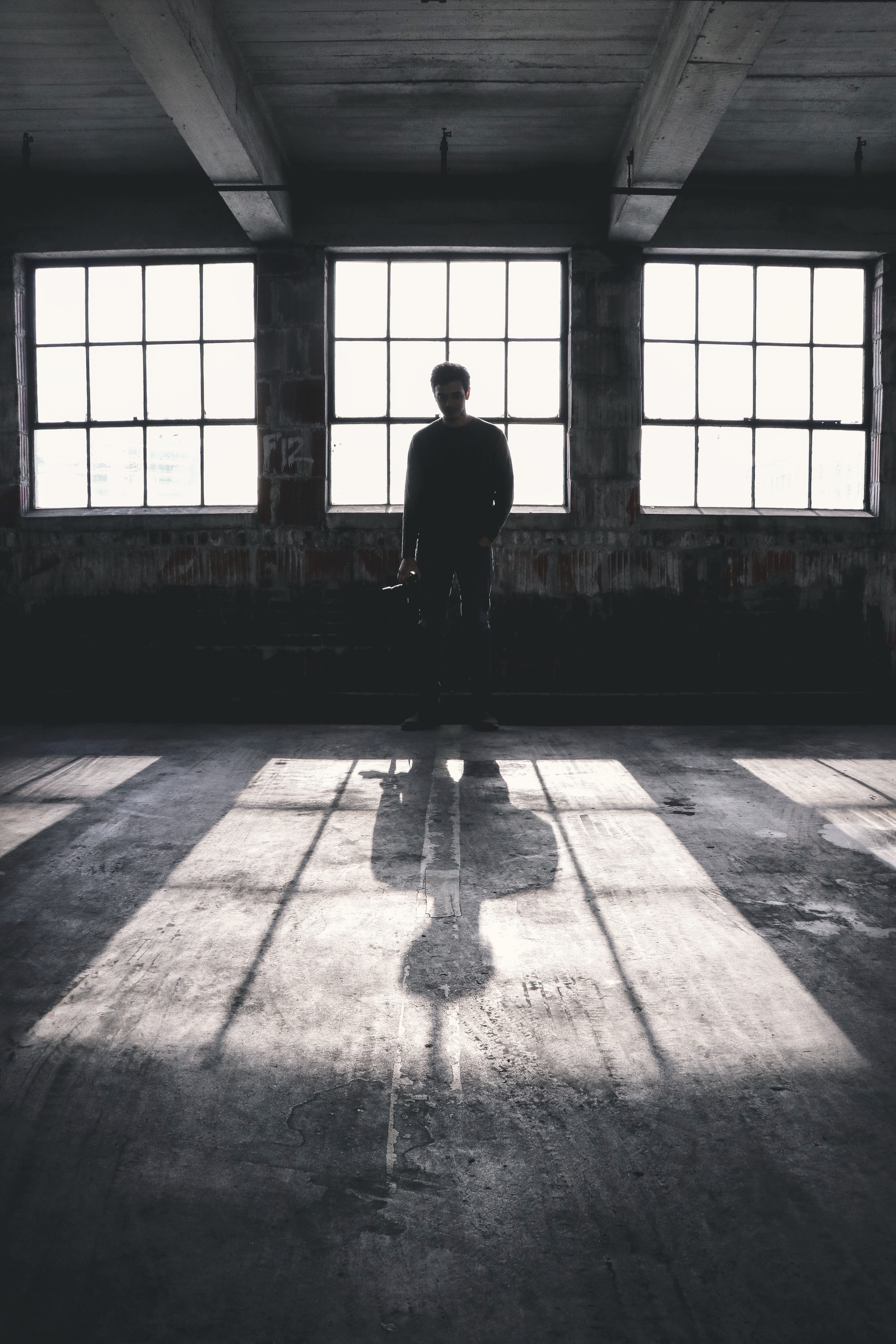 human, leisure activity, person, one person, lighting, flooring, ceiling, floor, zebra crossing, tarmac, windows, abandoned, prison, rear view, road, real people, Phone HD Wallpaper