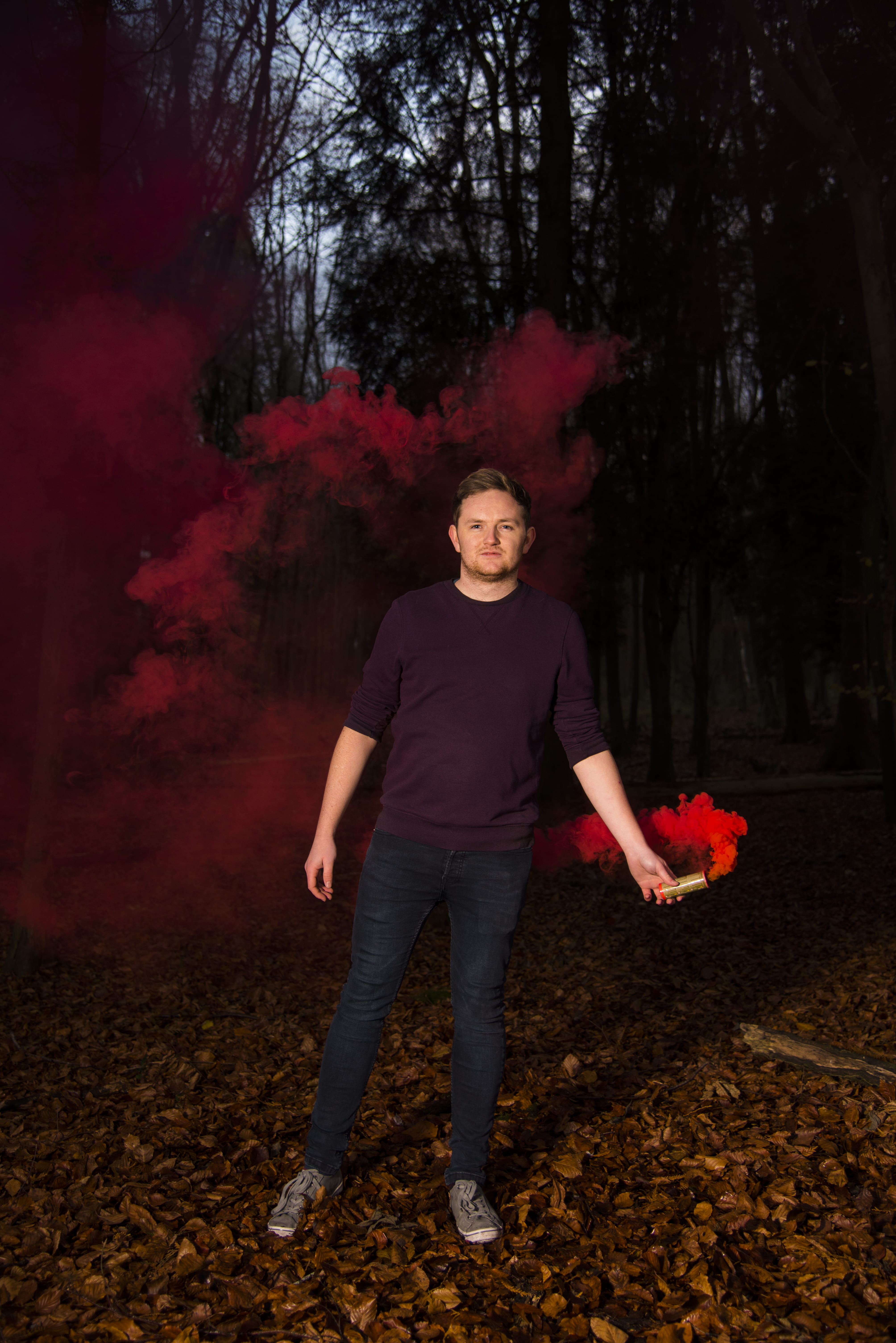 smoke, nature, leaf, denim, tree, brown, front view, red, blue, jeans, portrait, looking at camera, tube, full length, standing, sweatshirt, holding, plant part, Phone HD Wallpaper
