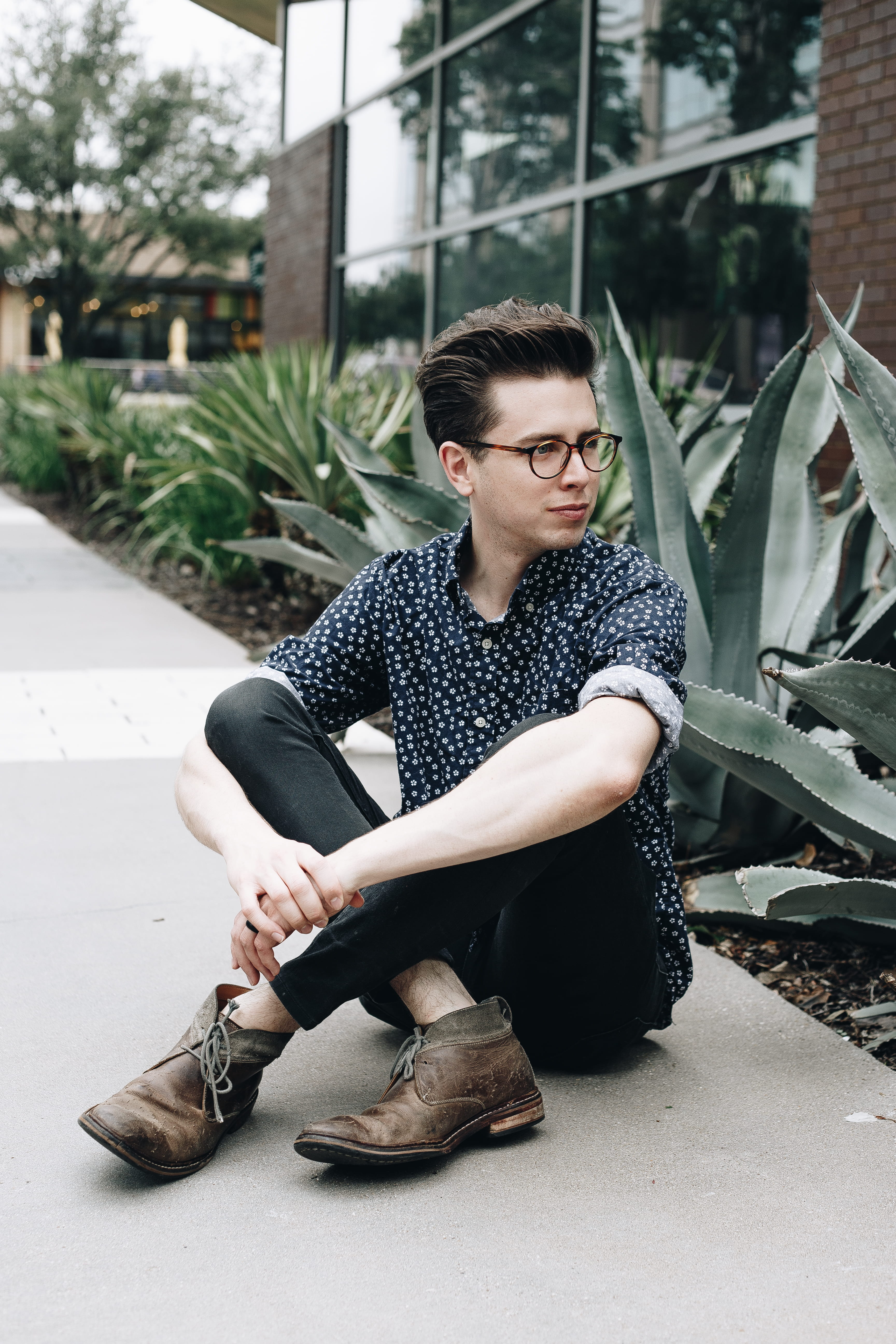 sunglasses, fashion, man, window, pose, cool, hipster, cheerful, confidence, urban Scene, jeans, street, 5K, leaves, sat, young Men, beard, males, plant, Phone HD Wallpaper