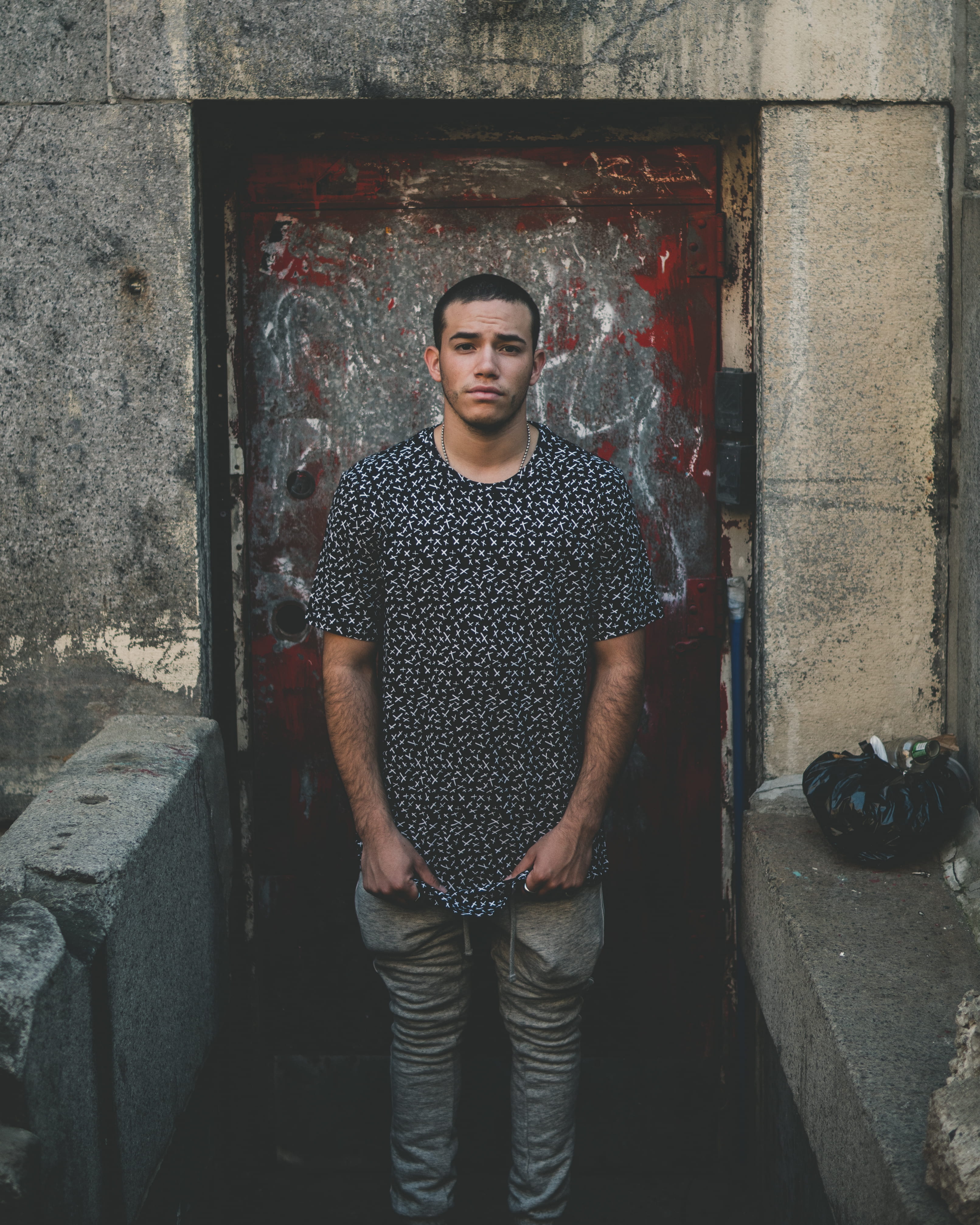 sigma, male, top, architecture, hands in pockets, young men, graffiti, caucasian, young adult, 4K, doorway, built structure, real people, wall, front view, Phone HD Wallpaper