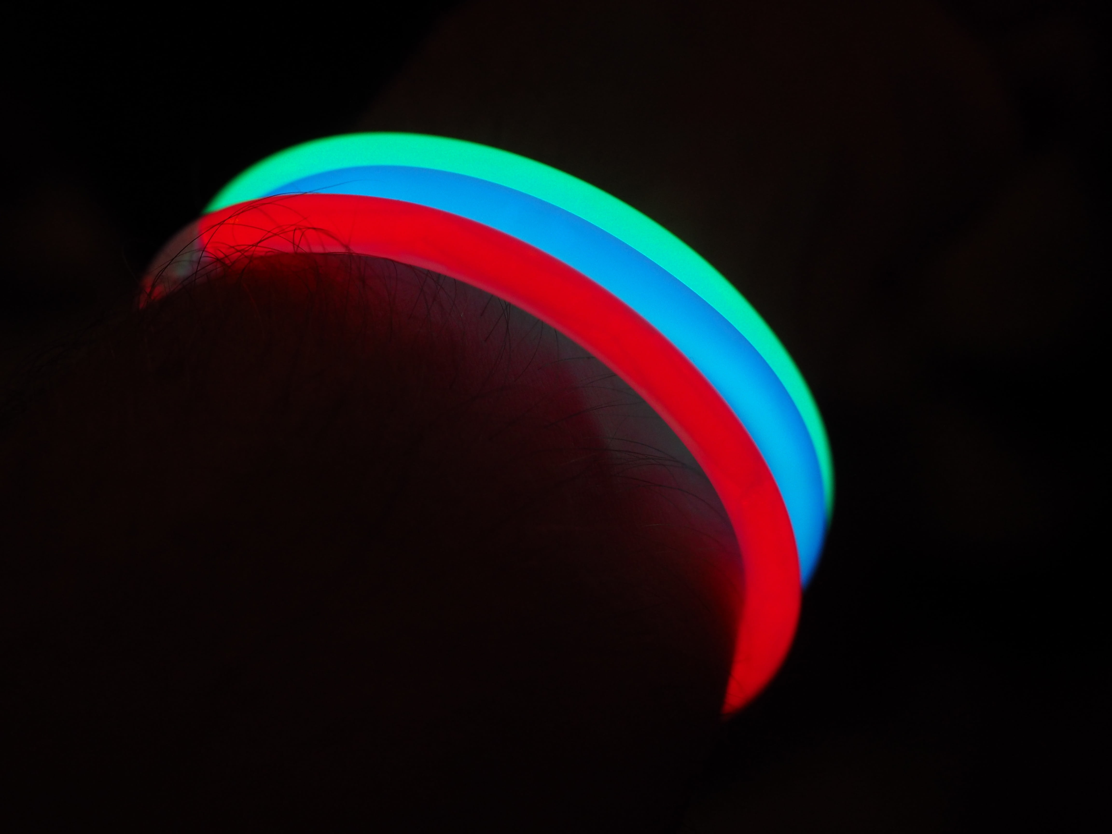 focus on foreground, men, deco, flag, arm, yellow, multi Colored, bangle, red, colorful, body part, rainbow, lights, indoors, illuminated, light, black background, HD Wallpaper