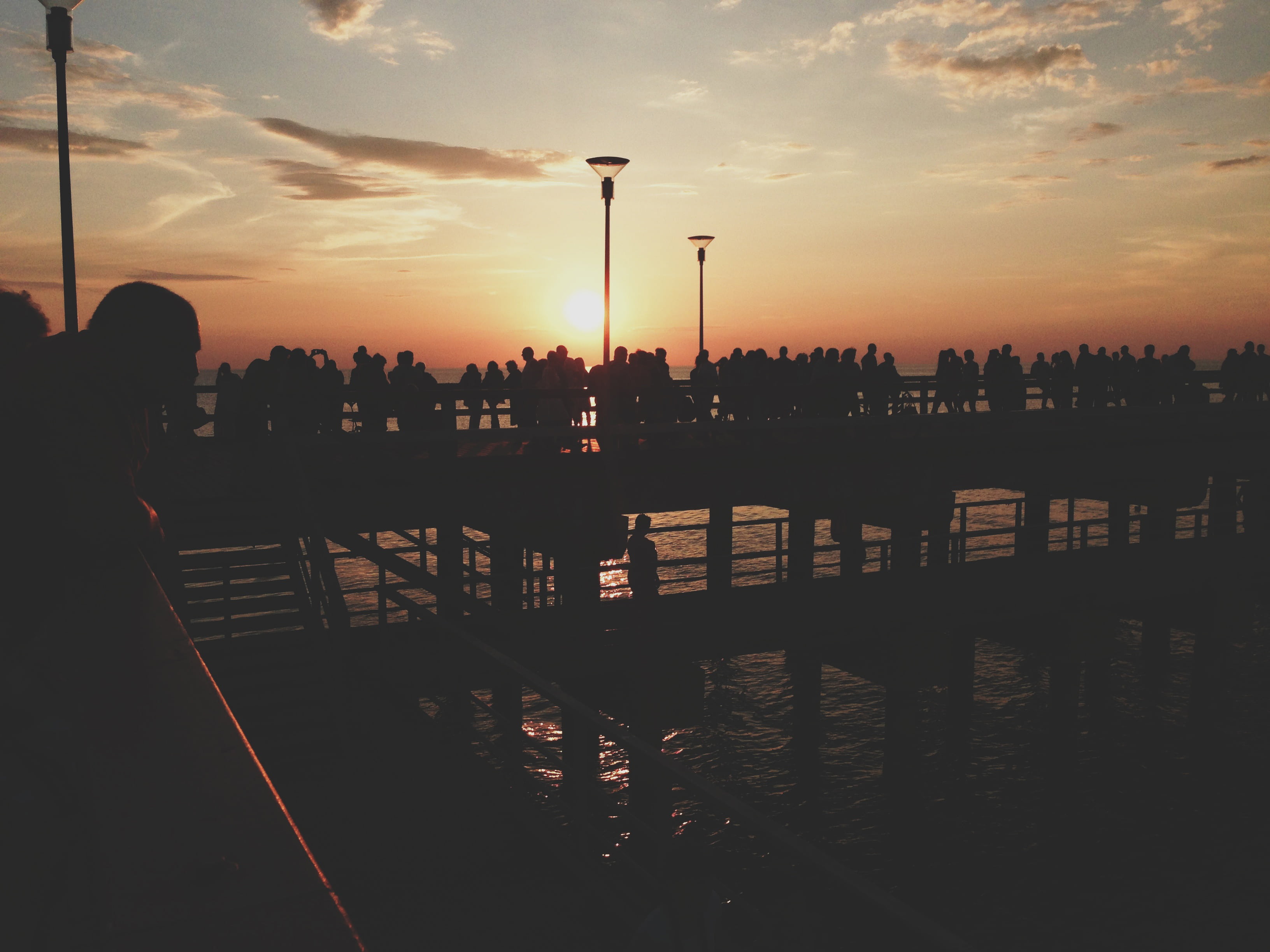 built structure, city, architecture, sun, dock, beach, beauty in nature, lifestyles, nature, orange color, cloud - sky, crowd, ocean, sunset, outdoors, HD Wallpaper