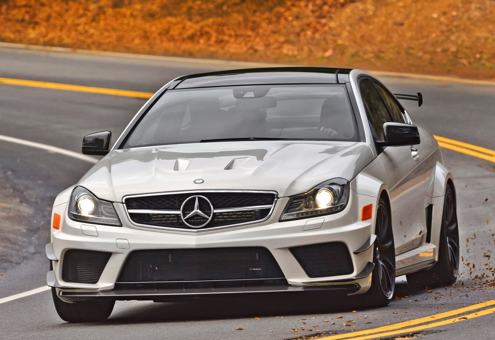 day, 720P, c63, car, series, amg, city, mode of transportation, no people, street, travel, coupe, traffic, outdoors, transportation, stationary, yellow, HD Wallpaper