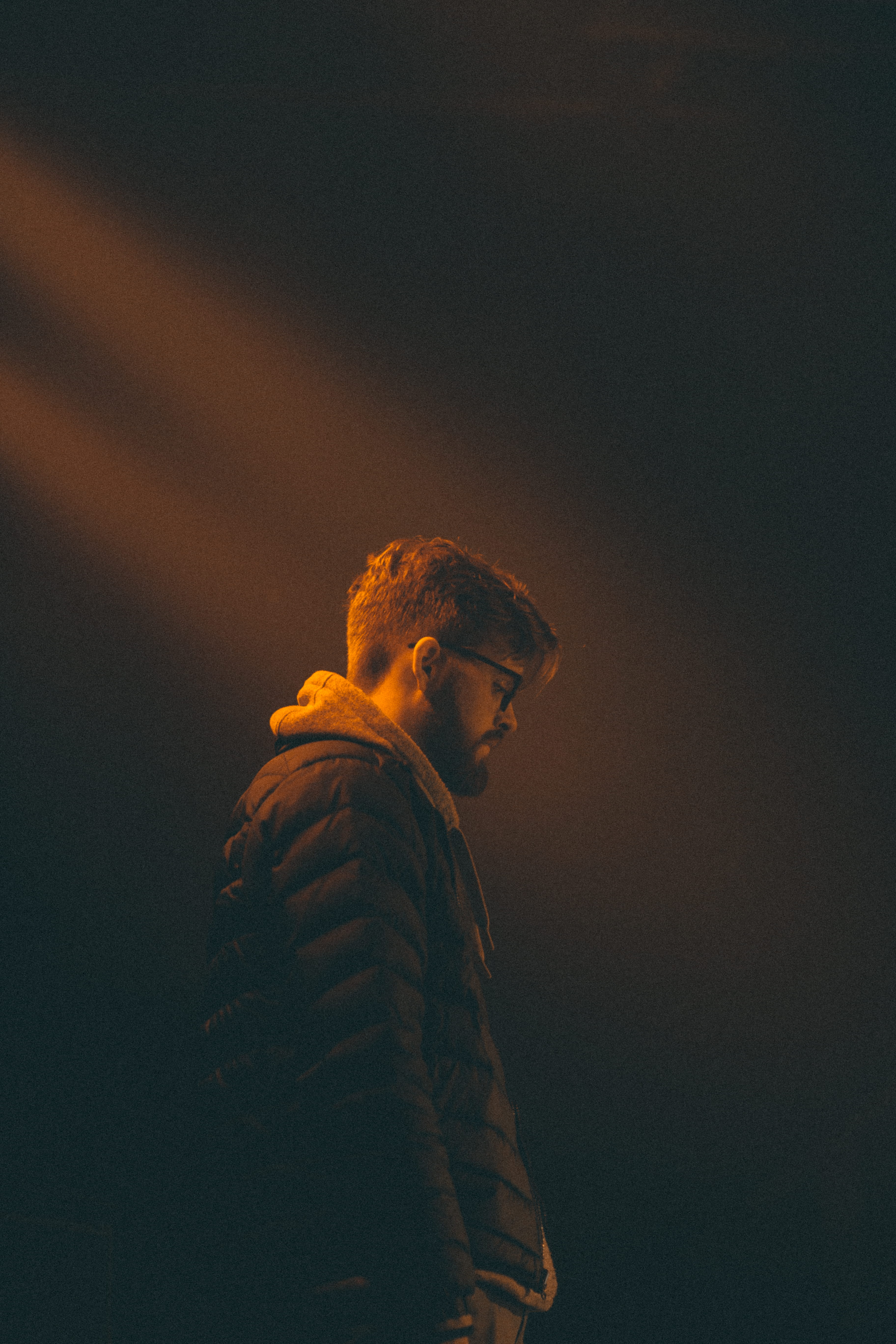 men, three quarter length, looking, jacket, warm clothing, hoodie, contemplation, mood, dude, clothing, brown, male, looking away, light beam, standing, Phone HD Wallpaper
