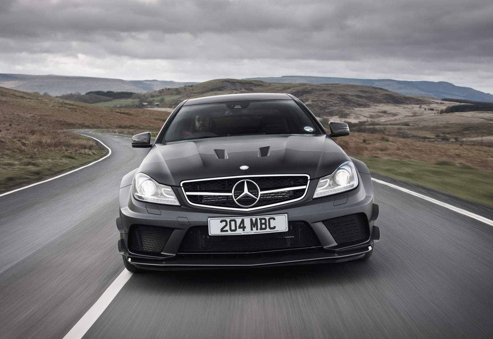 mountain, c63, black, mode of transportation, symbol, sky, no people, road trip, motor vehicle, motion, nature, scenics - nature, day, text, road, coupe, HD Wallpaper