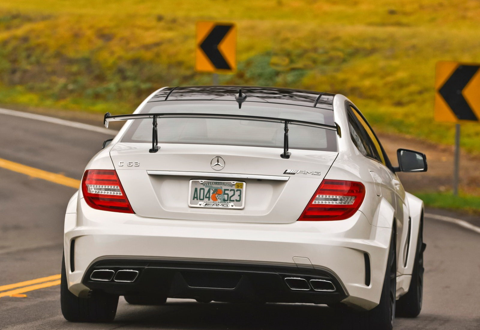 c63, day, 720P, sign, car, yellow, text, road, black, street, transportation, travel, amg, white color, city, no people, coupe, mercedes-benz, mode of transportation, HD Wallpaper