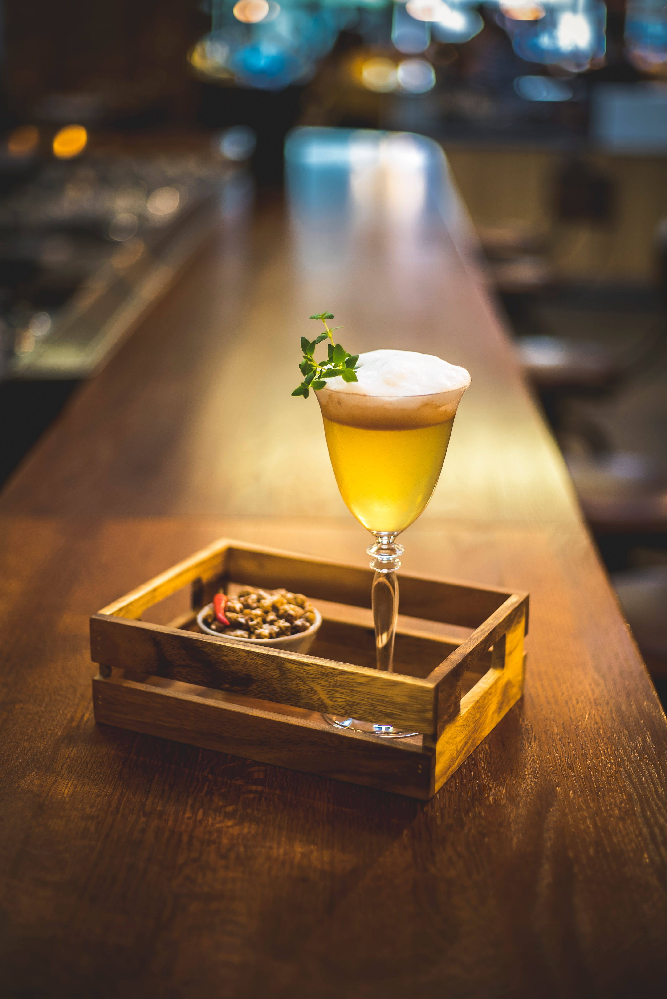 table, wood - material, cocktail, drinking glass, alcohol, martini, glass, garnish, food, focus on foreground, luxury, no people, mint leaf - culinary, Phone HD Wallpaper