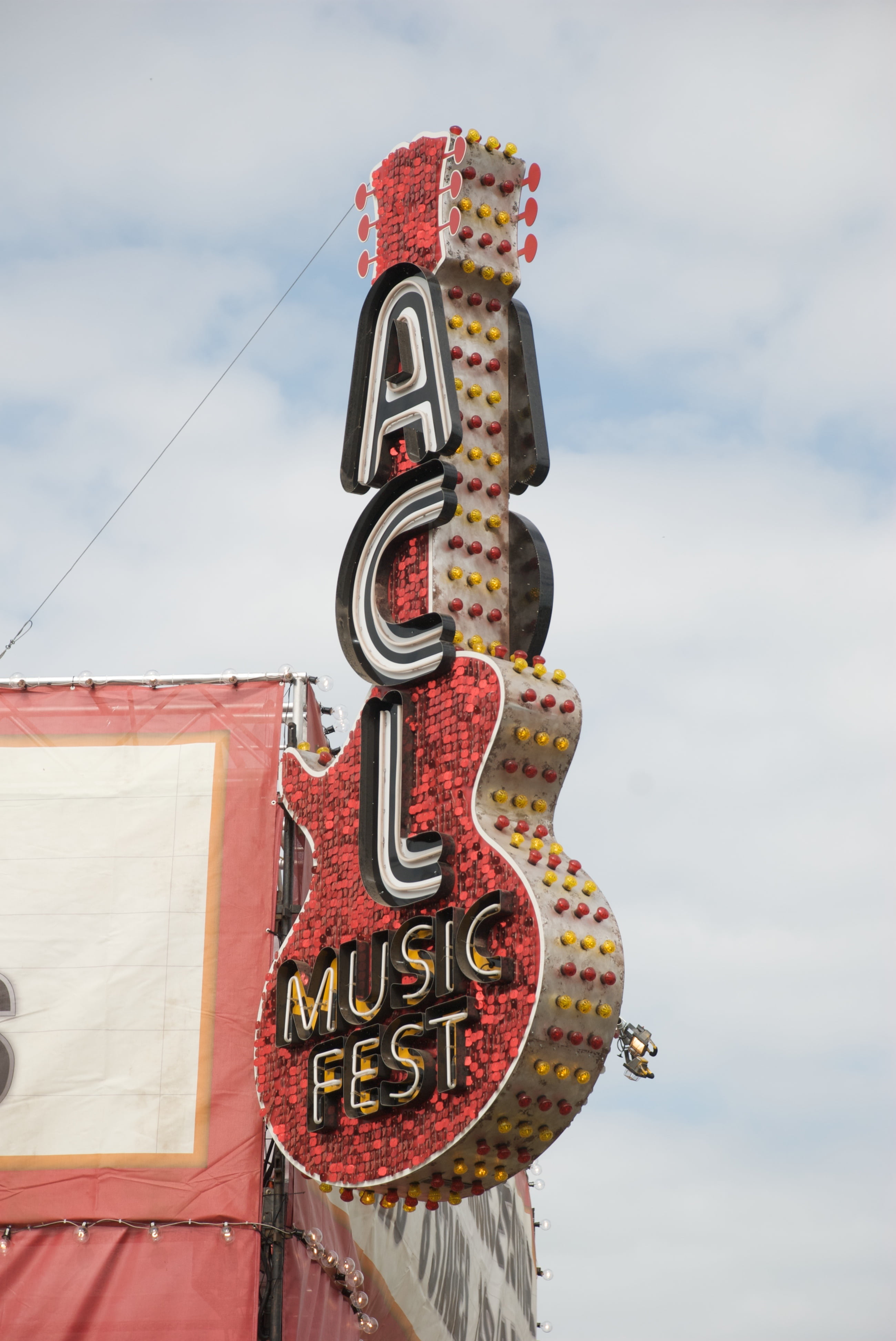 outdoors, low angle view, fest, acl, street, yellow, sky, daytime, guitar, day, close-up, amarican, number, signage, austin city, cloud - sky, sign, nature, Phone HD Wallpaper