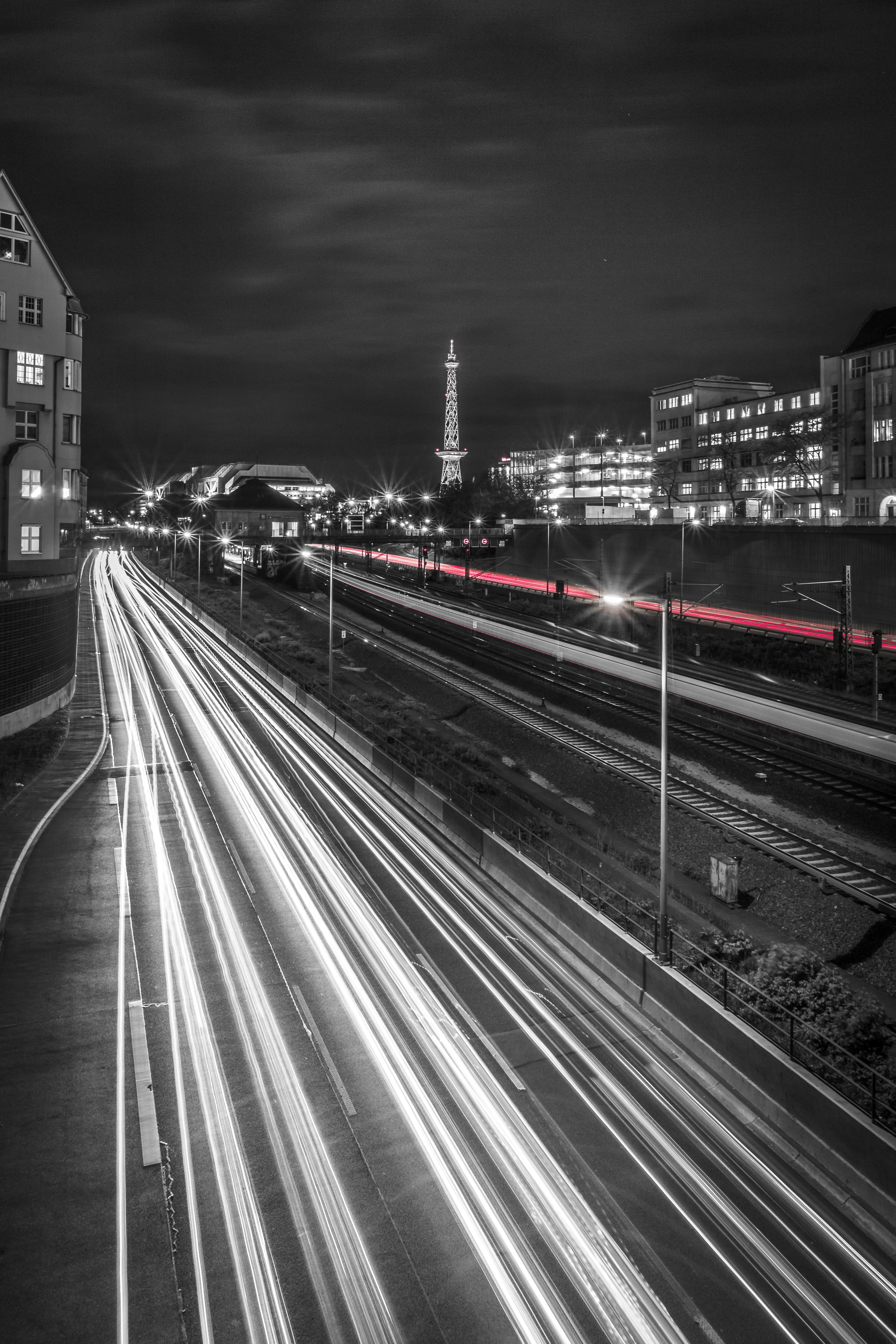 city, night, grayscale, mode of Transport, cloud - sky, motion, sky, transportation, big city, high angle view, radio tower, seemed, urban Scene, no people, Phone HD Wallpaper