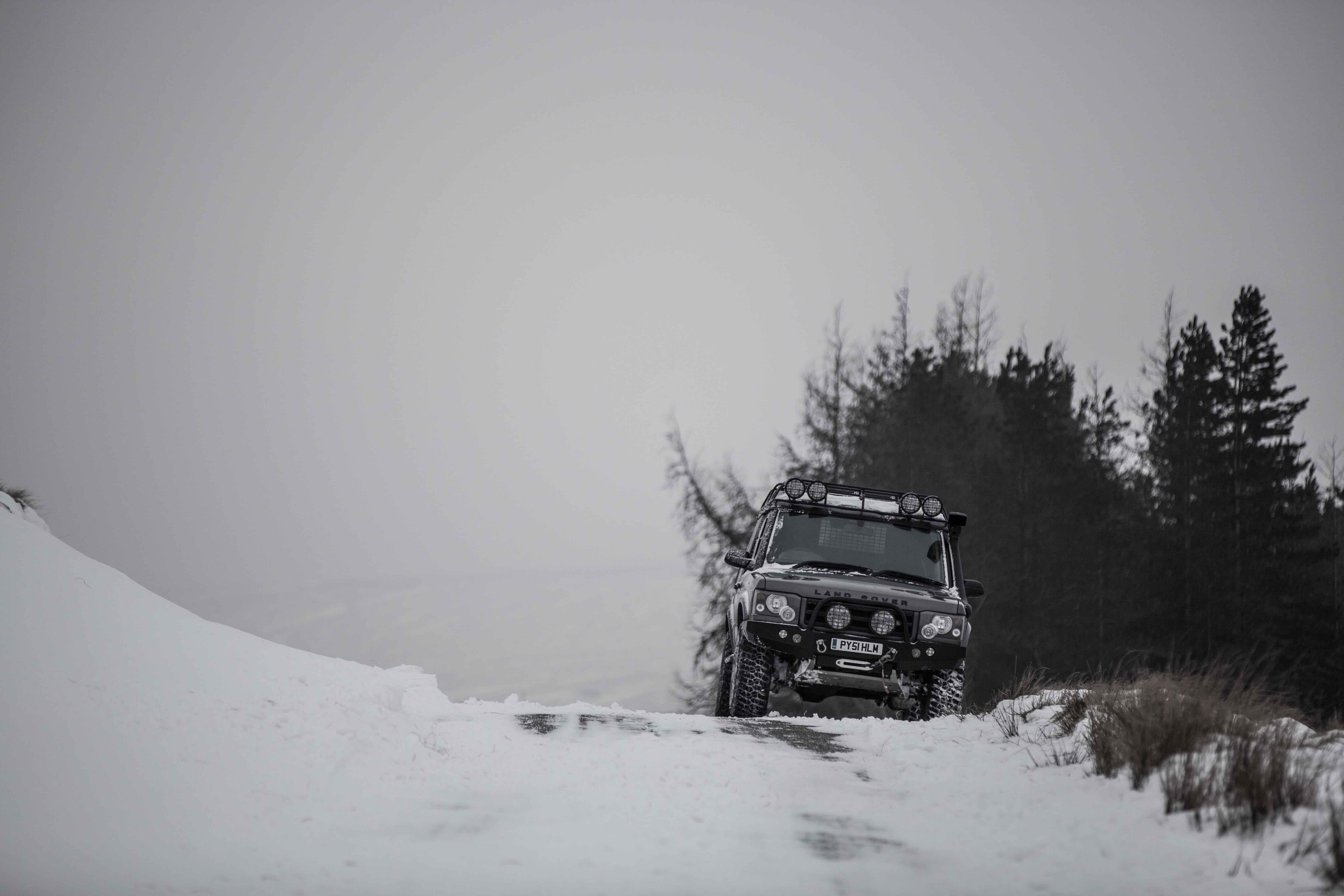 roadway, day, tree, non-urban scene, sky, land vehicle, land, motor vehicle, car, road, 5K, black, winter, transportation, leaf, offroad, no people, snowcapped mountain, HD Wallpaper