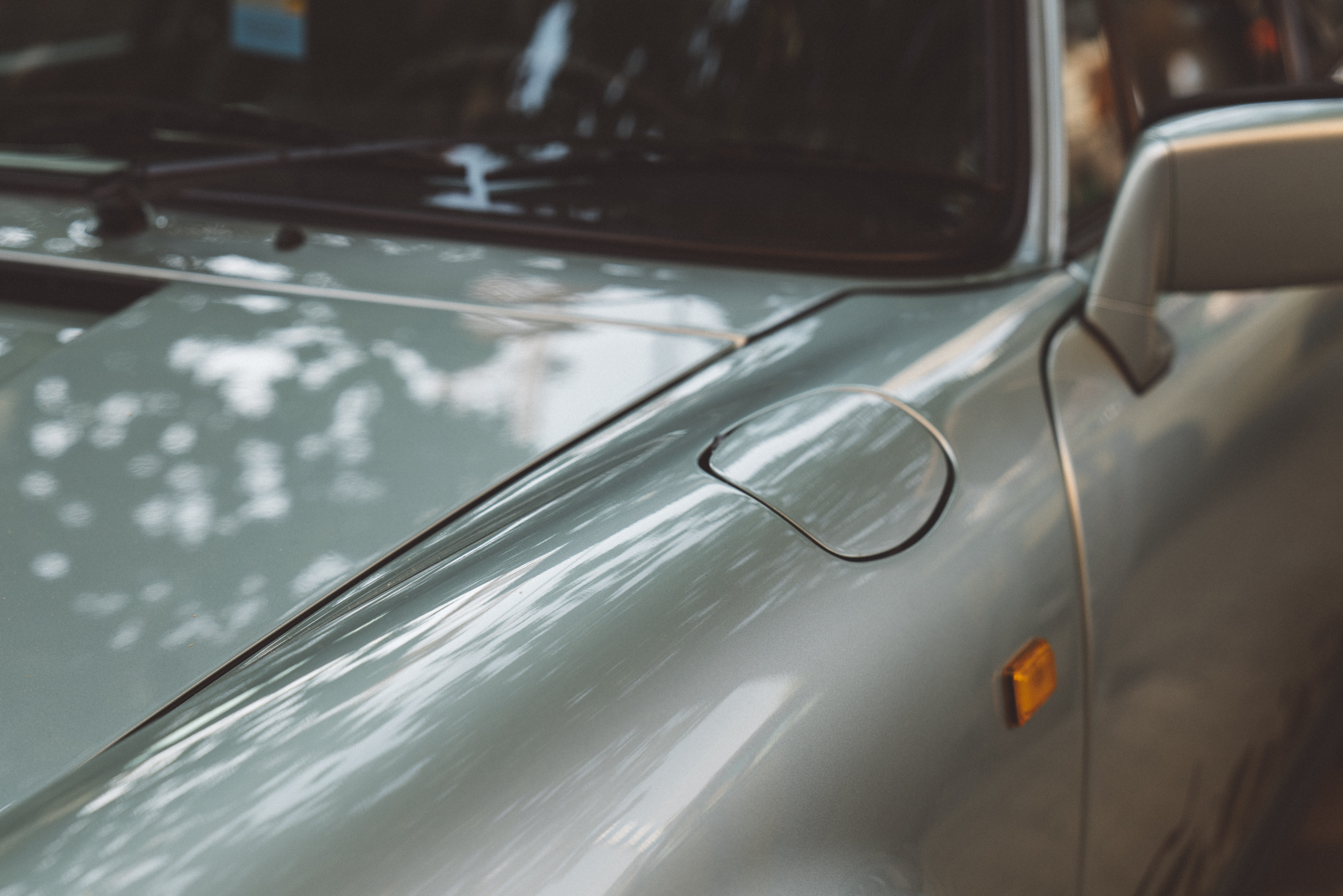 car mirror, cars, symbol, land vehicle, motion, porsche, nature, trademark, windshield, gray, reflection, logo, headlight, day, tire, no people, indoors, HD Wallpaper