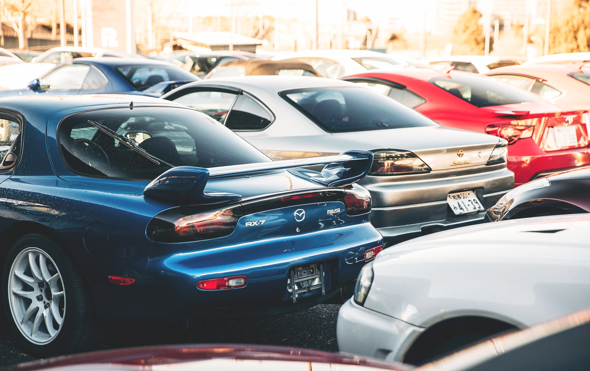day, vintage car, transportation, Mazda, mode of transportation, Nissan, Mazda RX-7, city, sunlight, architecture, in a row, stationary, street, depth of field, HD Wallpaper