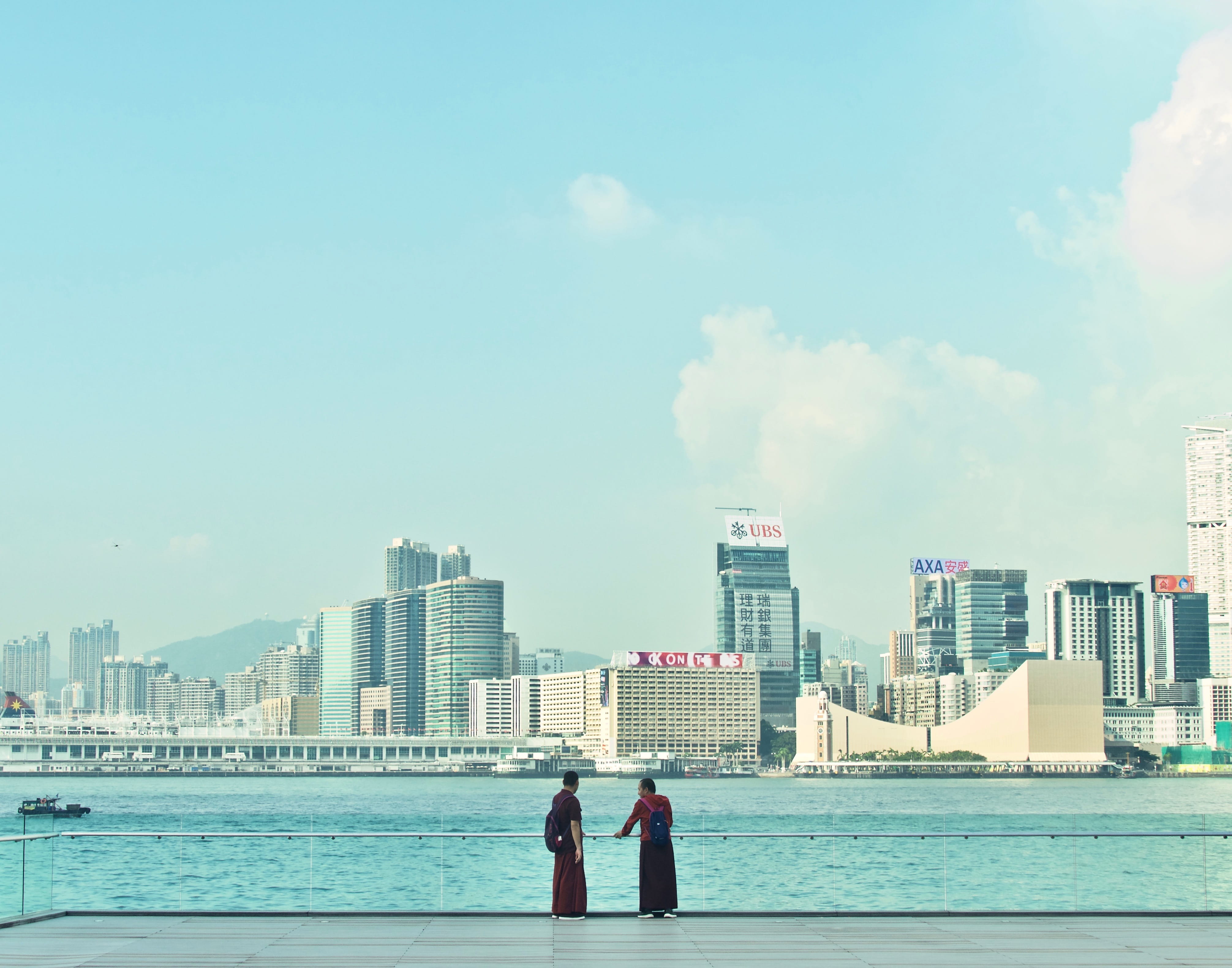 harbour, outdoors, sky, building, two people, cityscape, built structure, togetherness, cloud - sky, water, city, hong kong, coast, wan chai, real people, HD Wallpaper