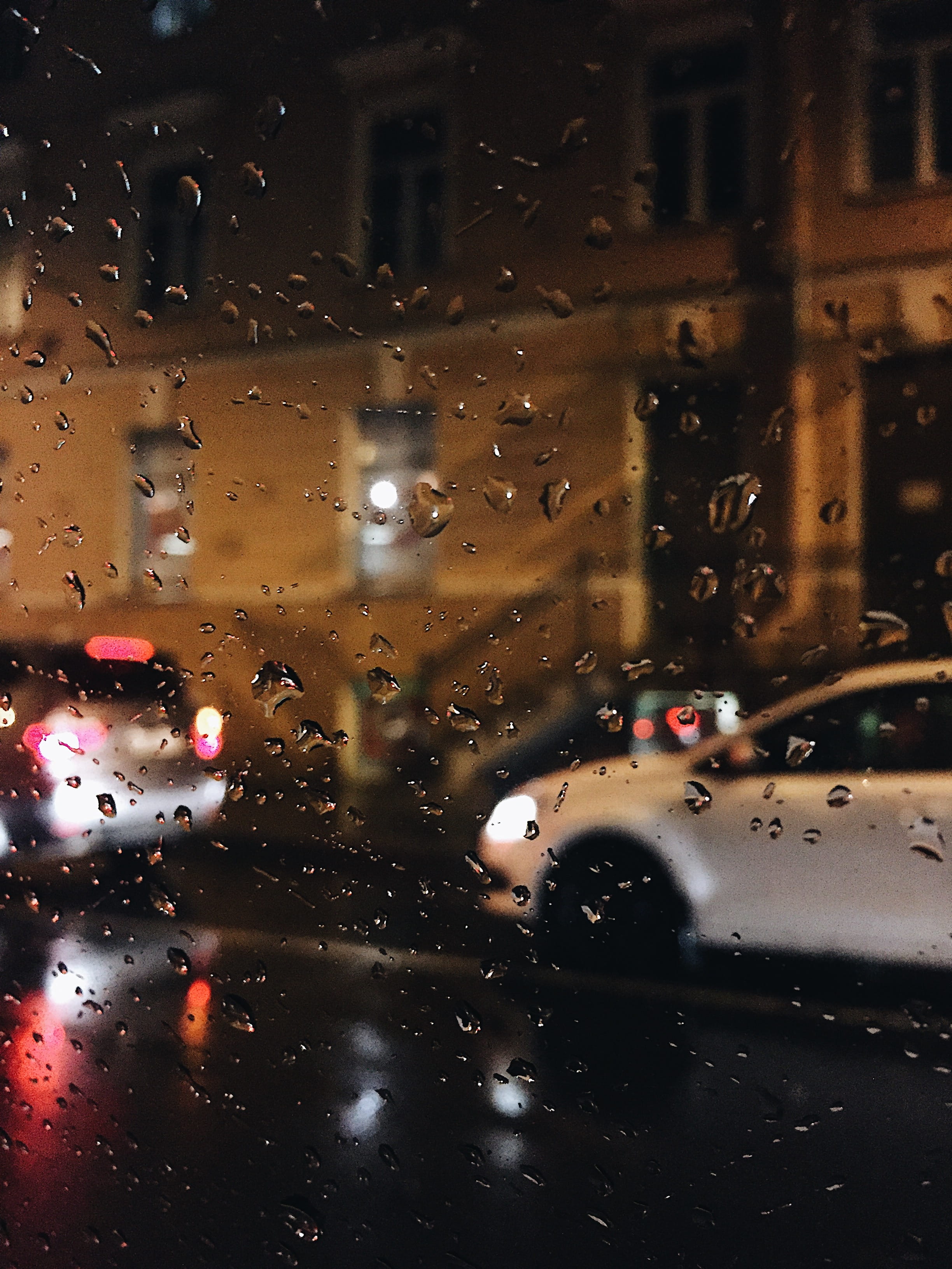 vehicle interior, raining, city, wet, landscape, building, raindrops, indoors, 2K, window, close-up, glass - material, dew, transportation, illuminated, Phone HD Wallpaper