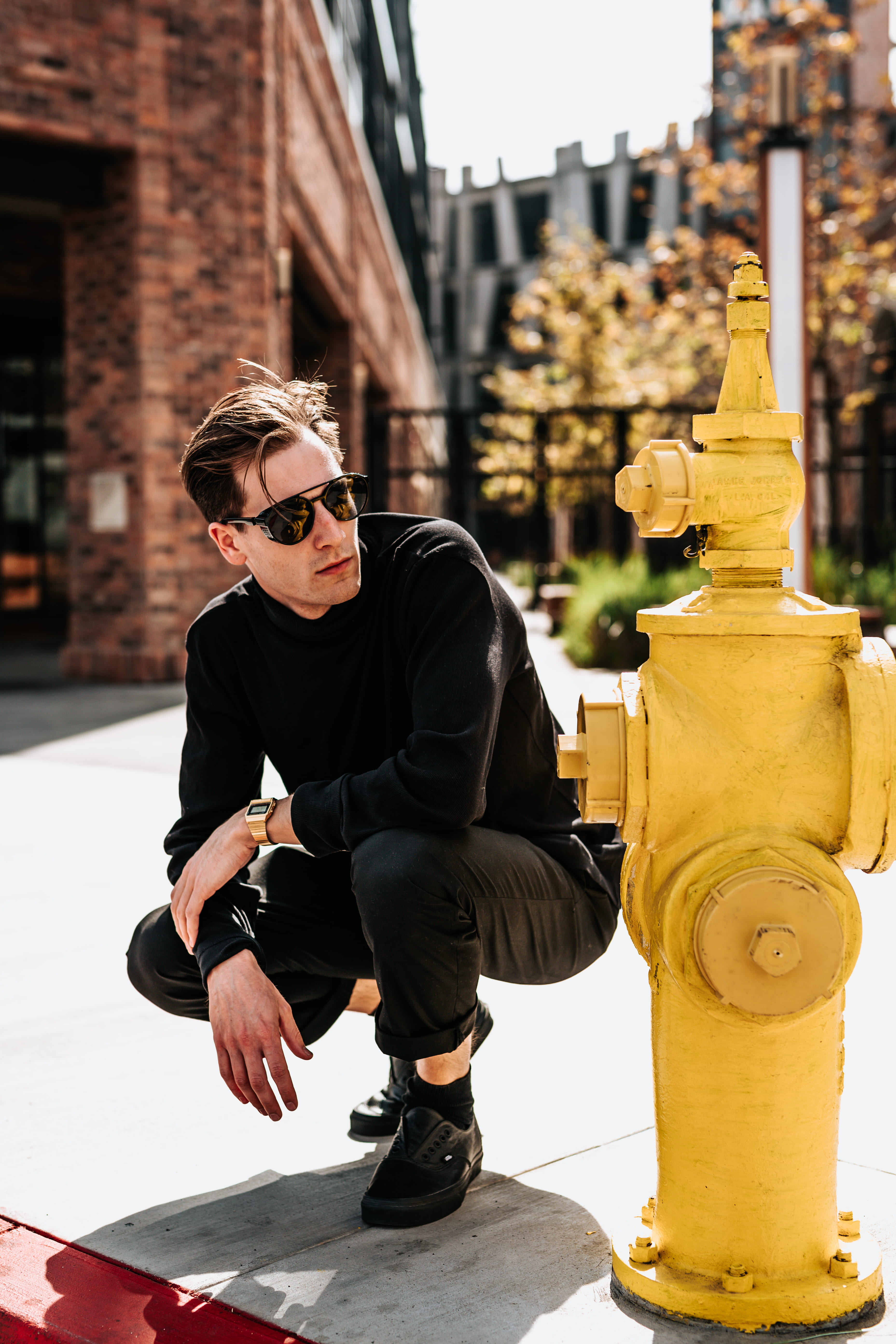 street wear, focus on foreground, keel, sitting, lifestyles, sunglasses, glasses, fashion line, hydrant, front view, posing, shoes, man, full length, young men, Phone HD Wallpaper