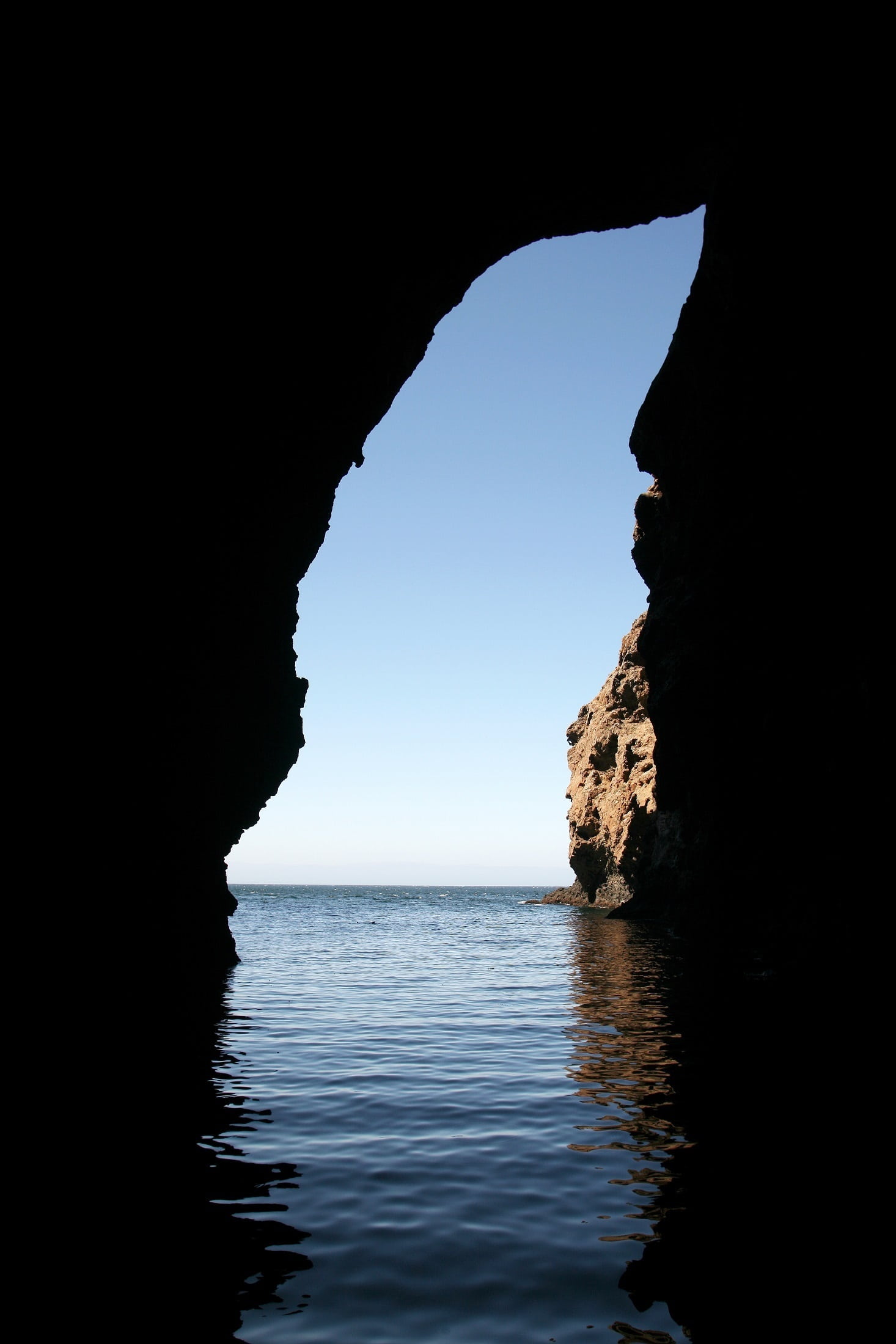 waterfront, daytime, eroded, rock - object, solid, blue, ocean, scenics, natural arch, santa cruz island, dark, rock formation, sea, body, light, no people, Phone HD Wallpaper