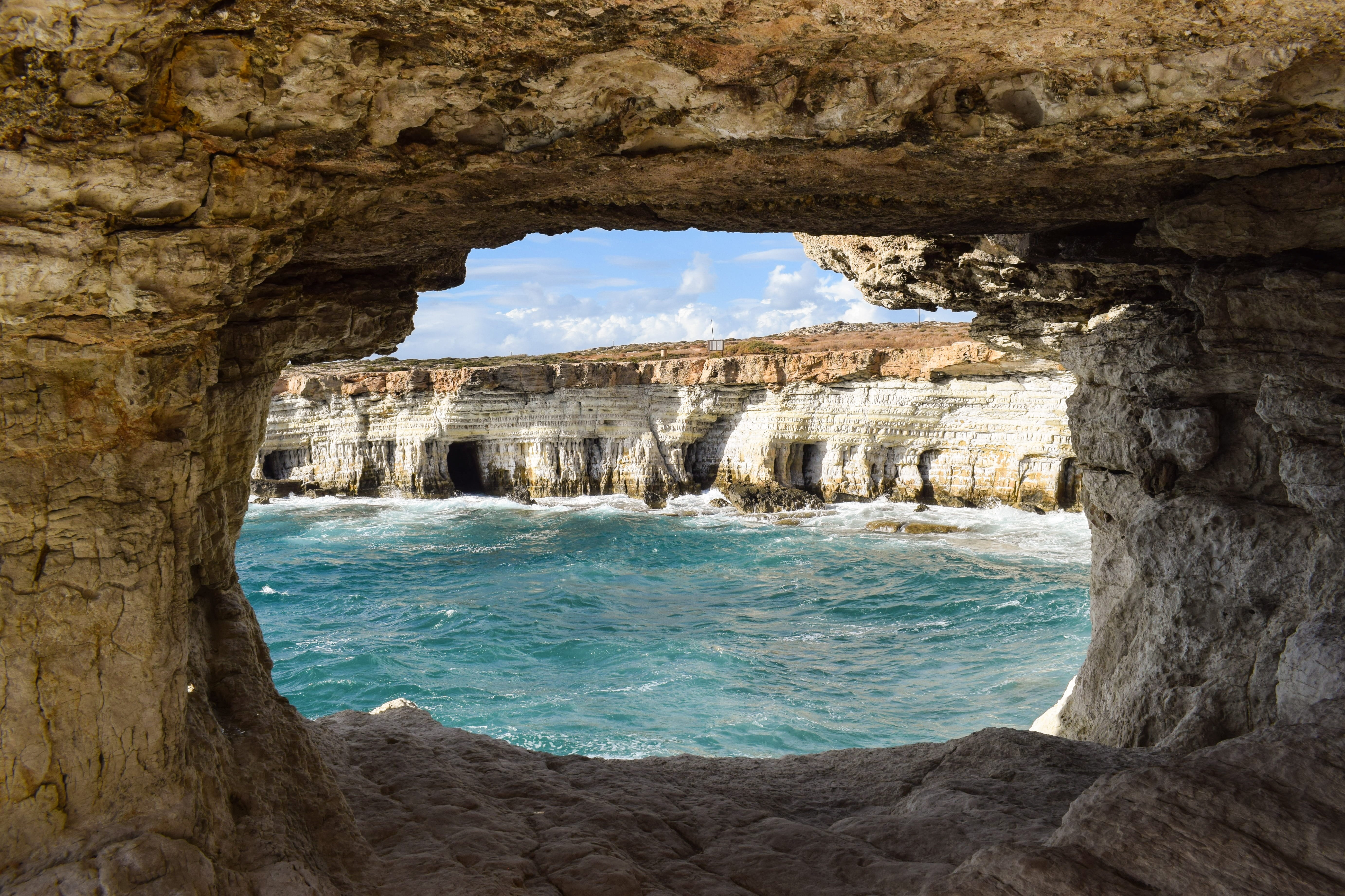 water, architecture, geology, rock - object, arch, land, sea caves, sky, window, 5K, stone, natural arch, scenic, sea, eroded, beauty in nature, cliff, HD Wallpaper