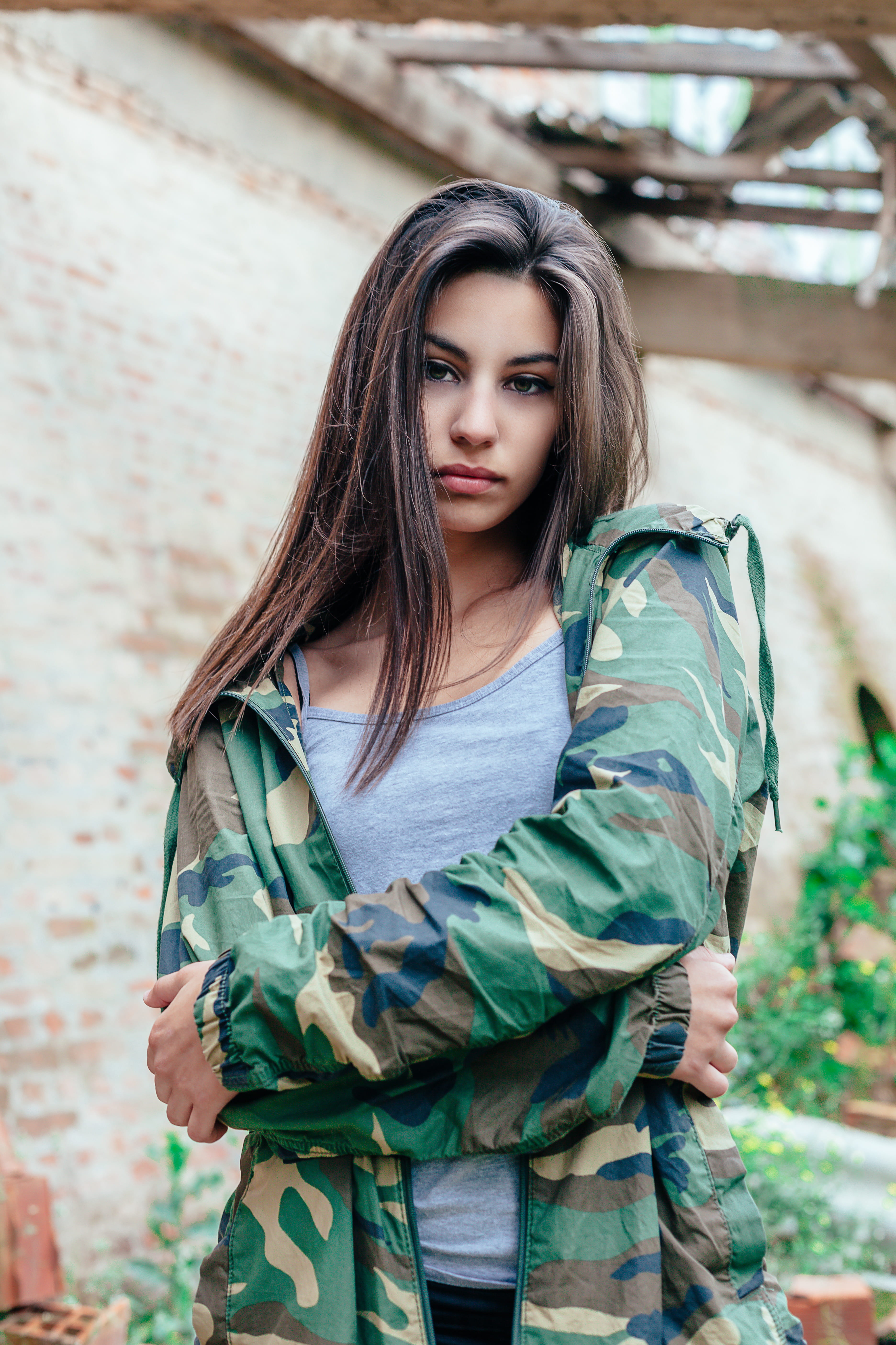 looking at camera, spaghetti, arms crossed, young women, hair, waist up, uniform, strap, front view, young, jacket, government, outdoors, brunette, brown hair, Phone HD Wallpaper