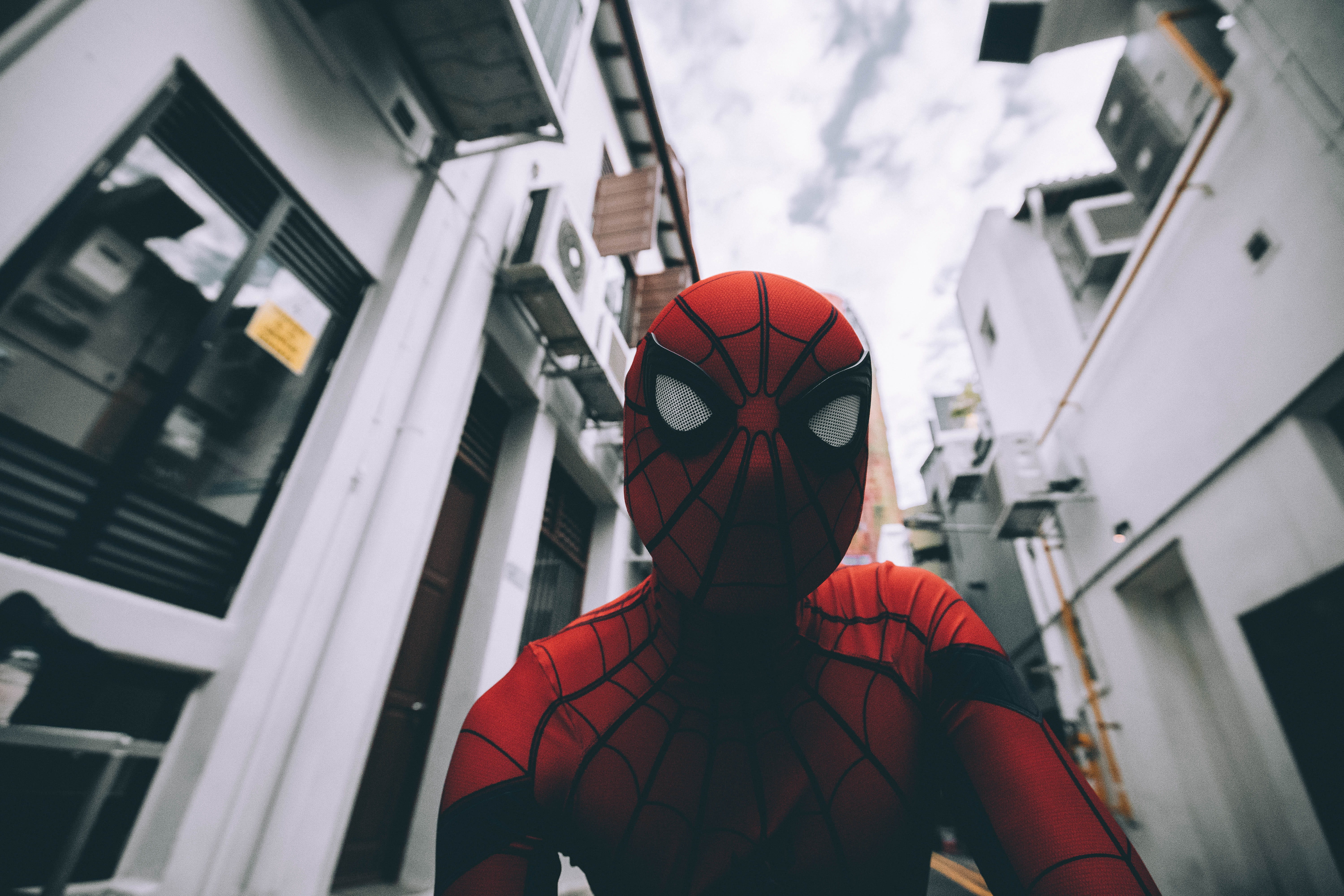 costume, sky, human, lifestyles, front view, spiderman, alley, window, superhero, focus on foreground, built structure, peter parker, day, real people, HD Wallpaper