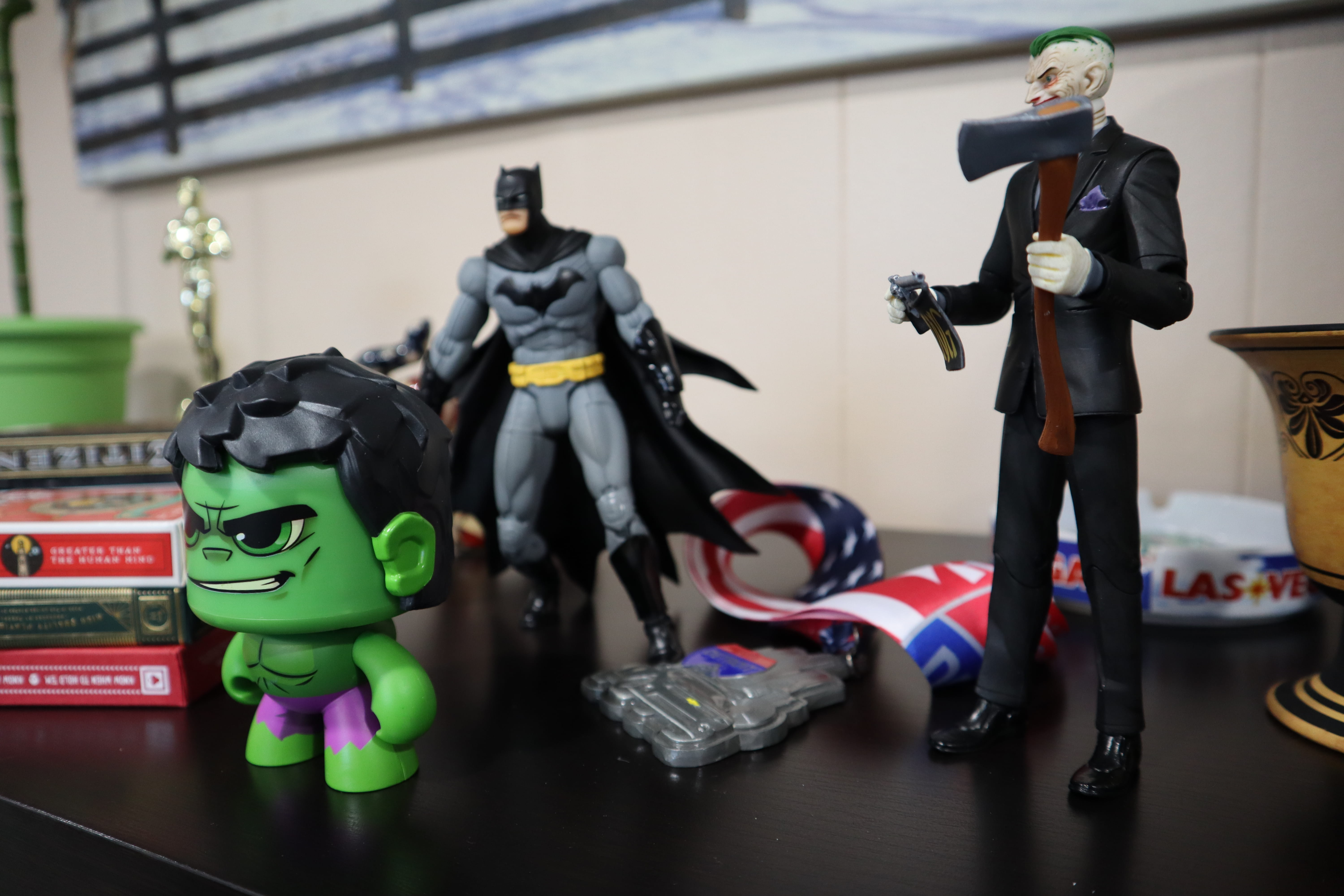 holding, police, human representation, tire, people, joker, figurine, human, villians, focus on foreground, representation, flag, toy, super heroes, military, HD Wallpaper