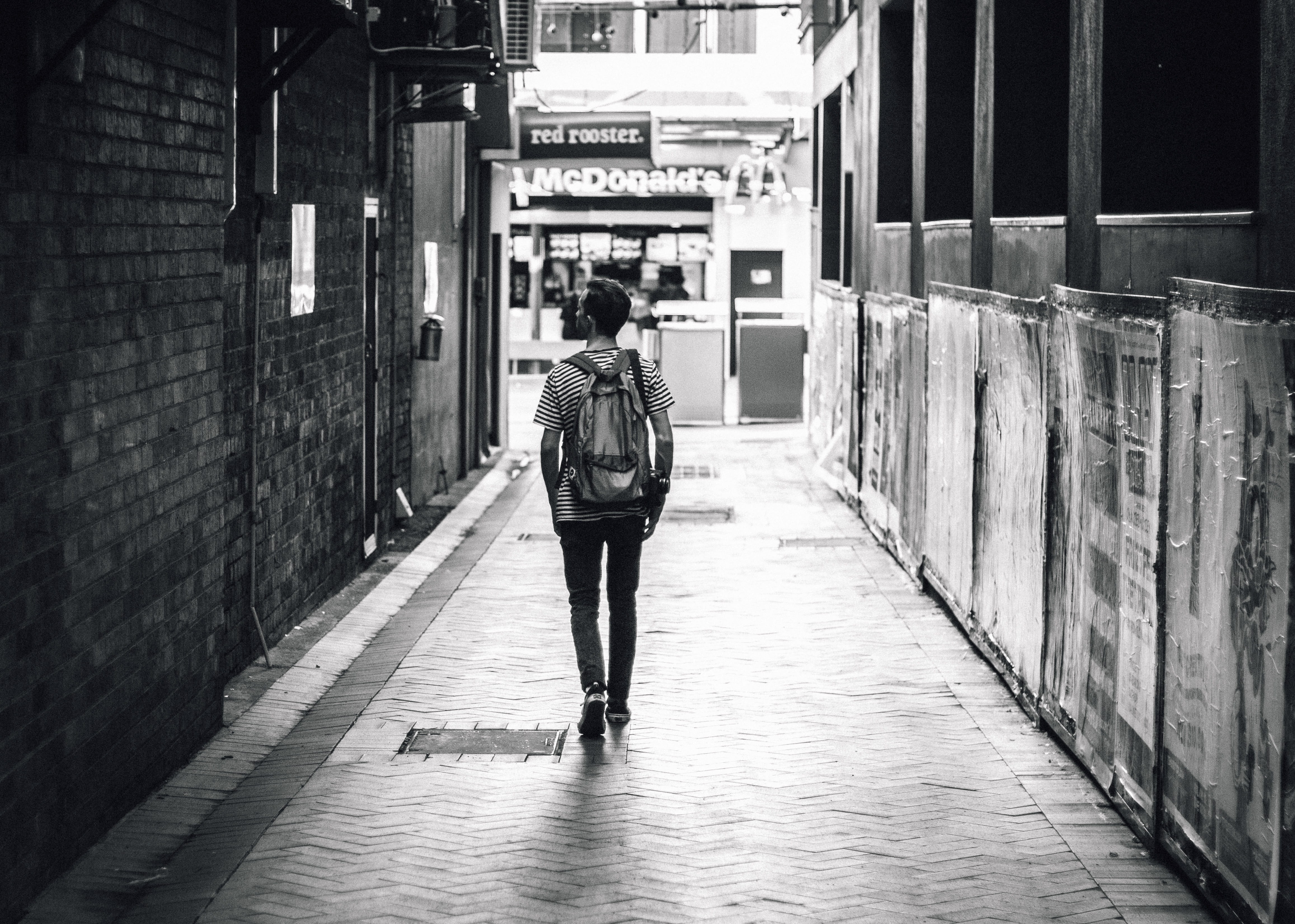 the way forward, walking, building exterior, lifestyles, walkway, city life, one, grayscale, adult, towards, transportation, real people, built structure, HD Wallpaper