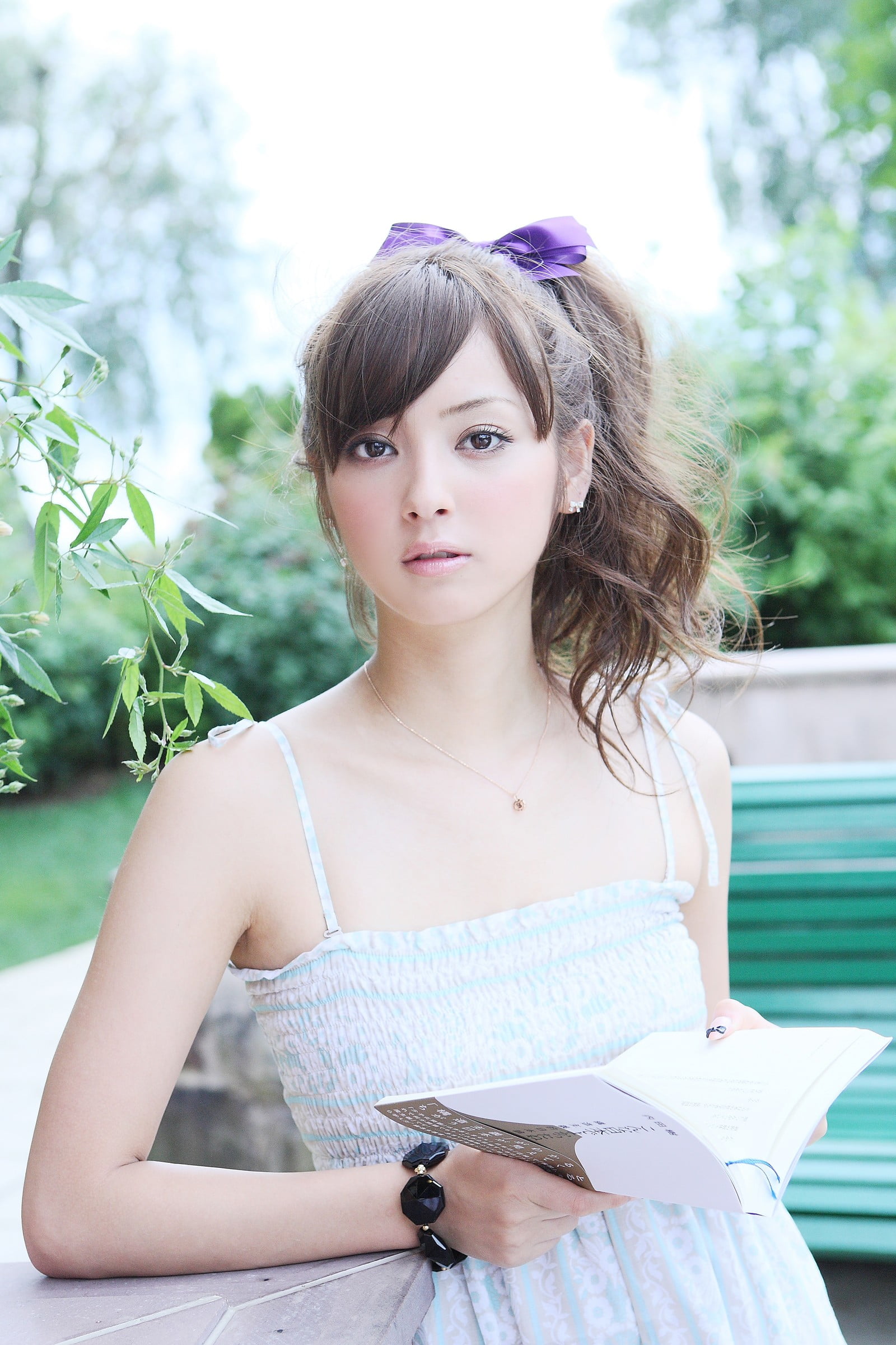 beautiful woman, model, brown hair, hairstyle, plant, looking, Sasaki Nozomi, hair, waist up, looking at camera, black, Asian, focus on foreground, portrait, Phone HD Wallpaper