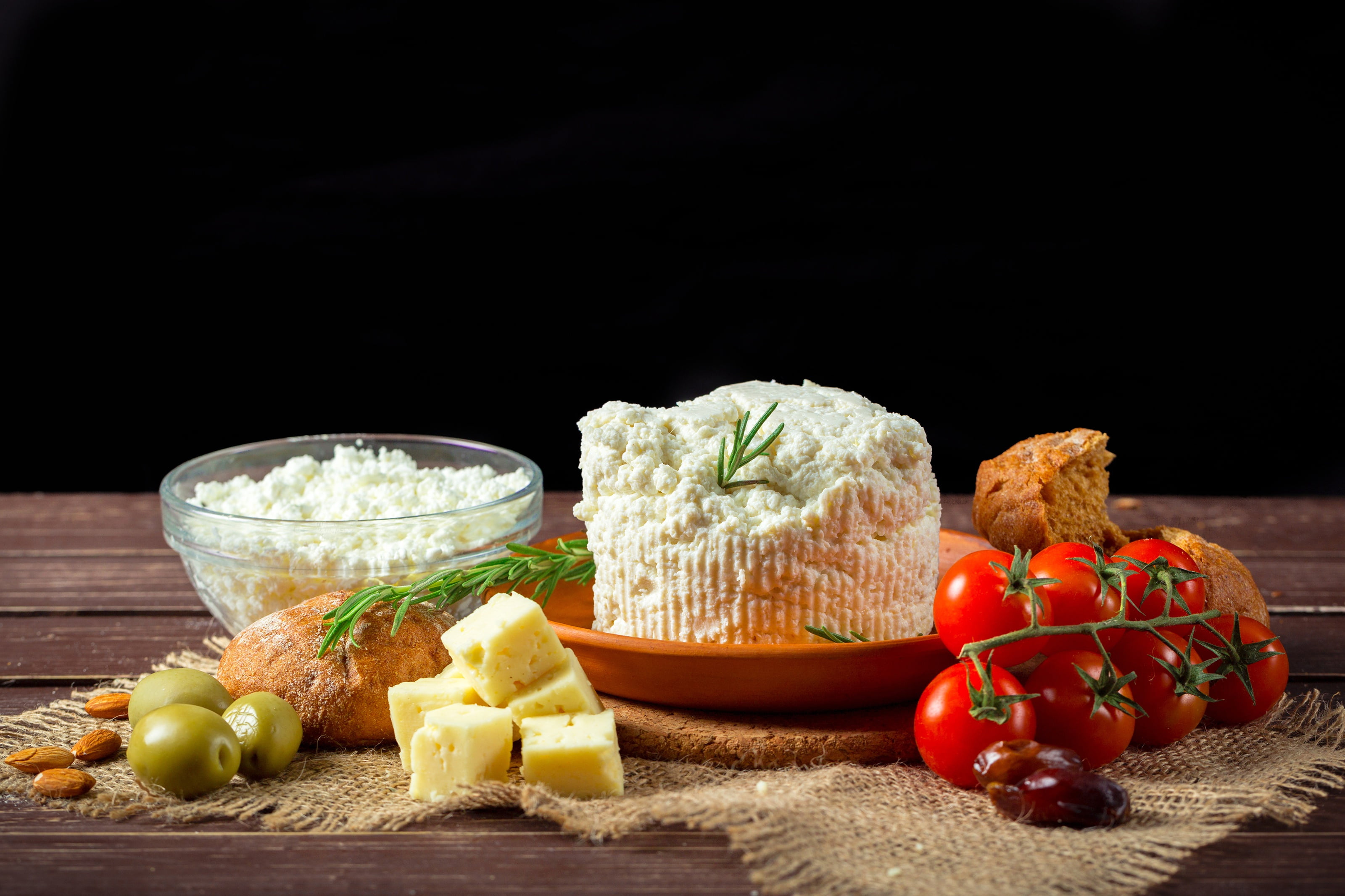 tomatoes, almonds, bokeh, bread, black background, 2K, dates, cheese, olives, table, plate, HD Wallpaper