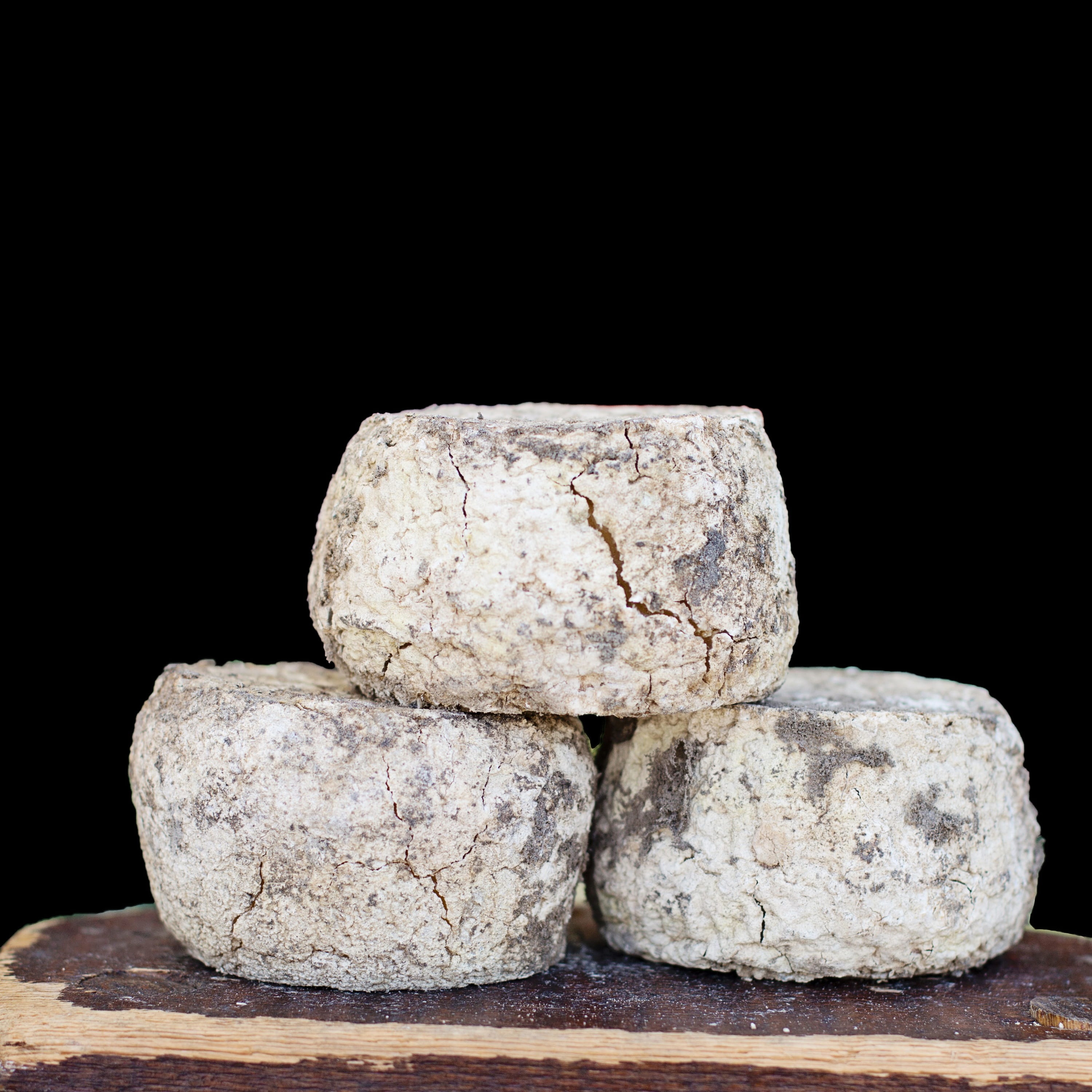 cut out, 2K, round, wooden, background, black, dairy, product, indoors, camembert, freshness, nobody, rock, cheese wheel, no people, board, black background, Phone HD Wallpaper