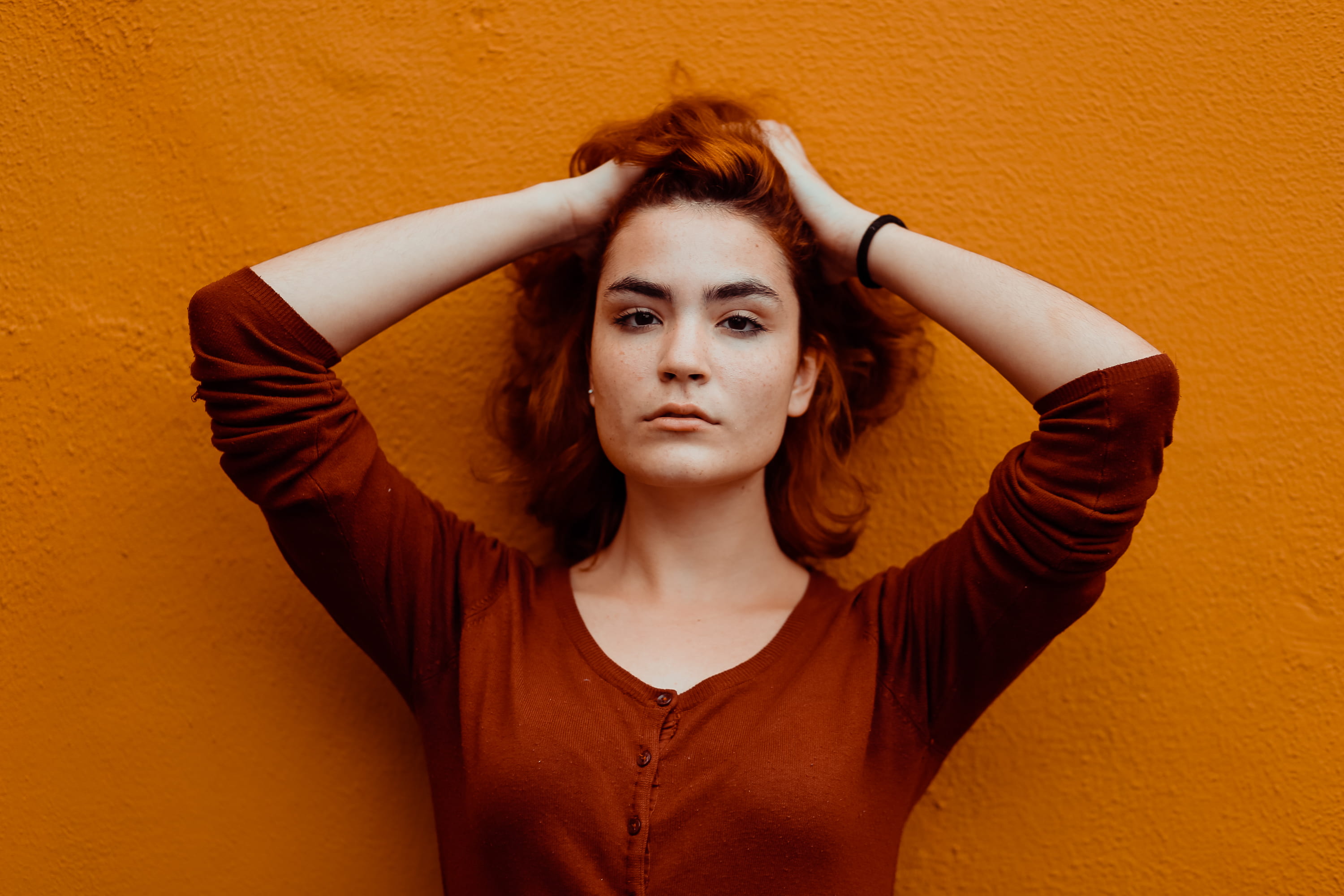 looking, casual clothing, colored background, model, style, orange color, hand, front view, teenager, hands in hair, looking at camera, one color, beauty, HD Wallpaper