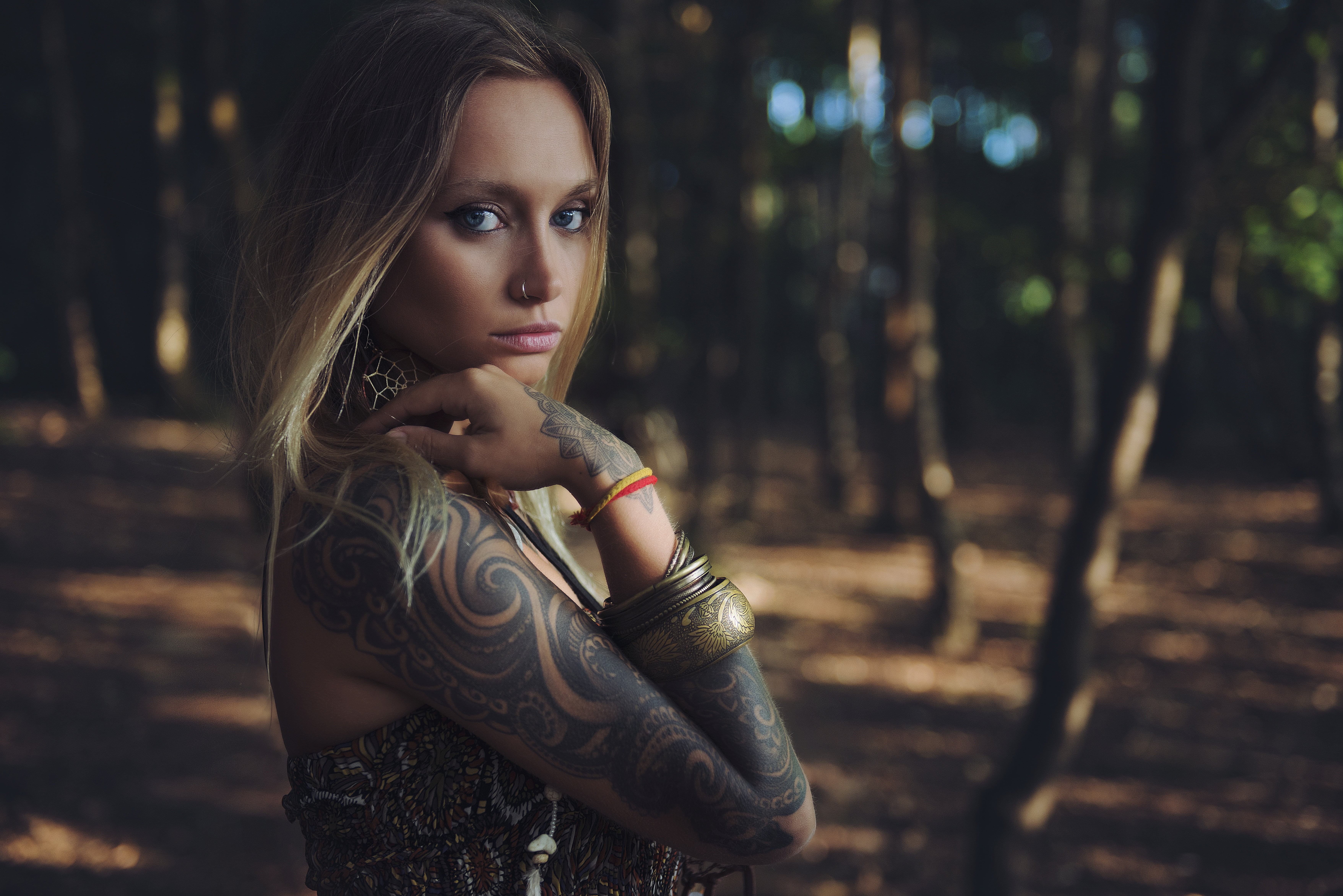 contemplation, blue eyes, beautiful woman, standing, young adult, looking at viewer, pierced nose, focus on foreground, looking at camera, tattoo, tree, HD Wallpaper