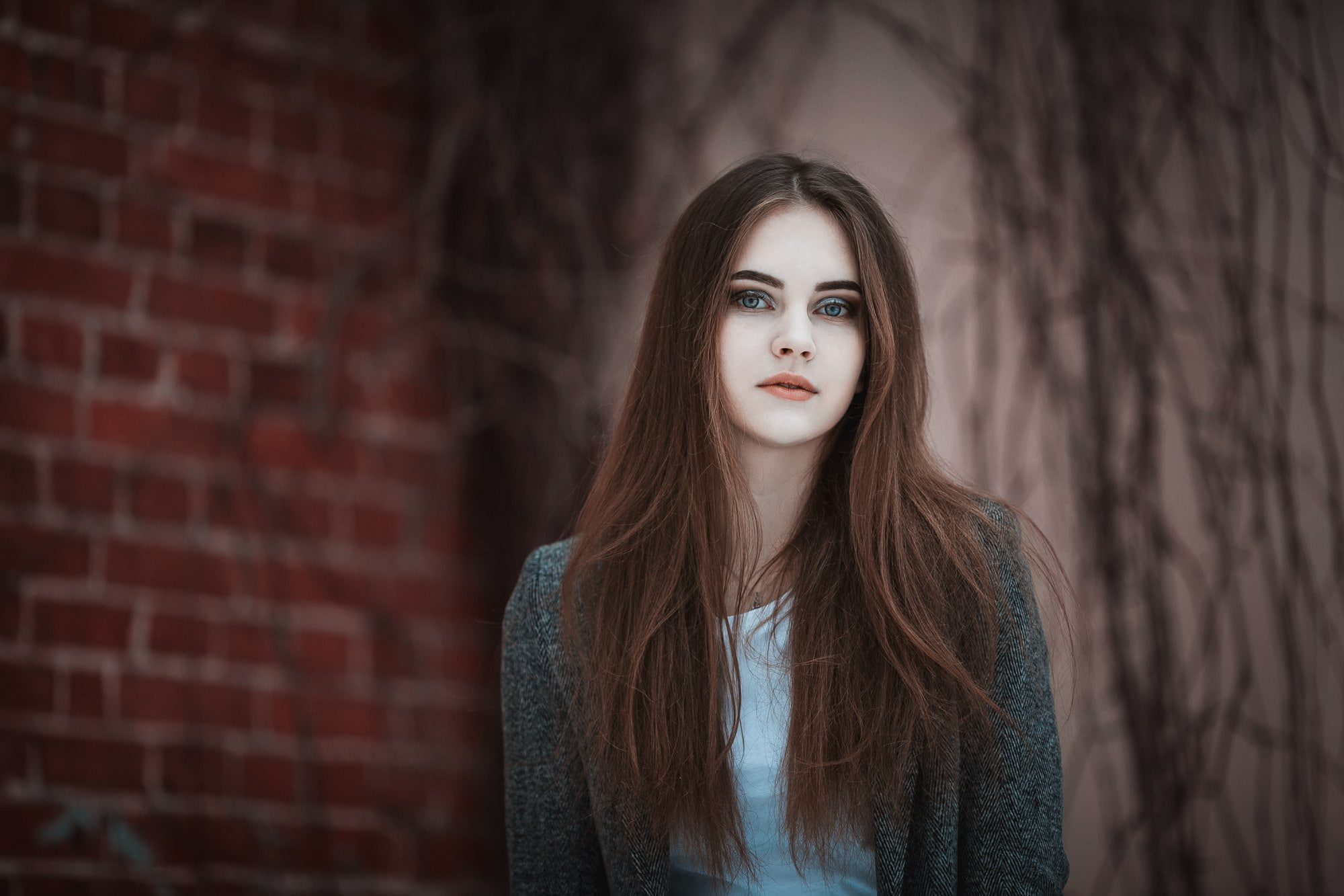 grey coat, front view, bricks, hairstyle, 1080P, adult, depth of field, young women, beautiful people, wall, blue eyes, hair, brick wall, women, one person, HD Wallpaper