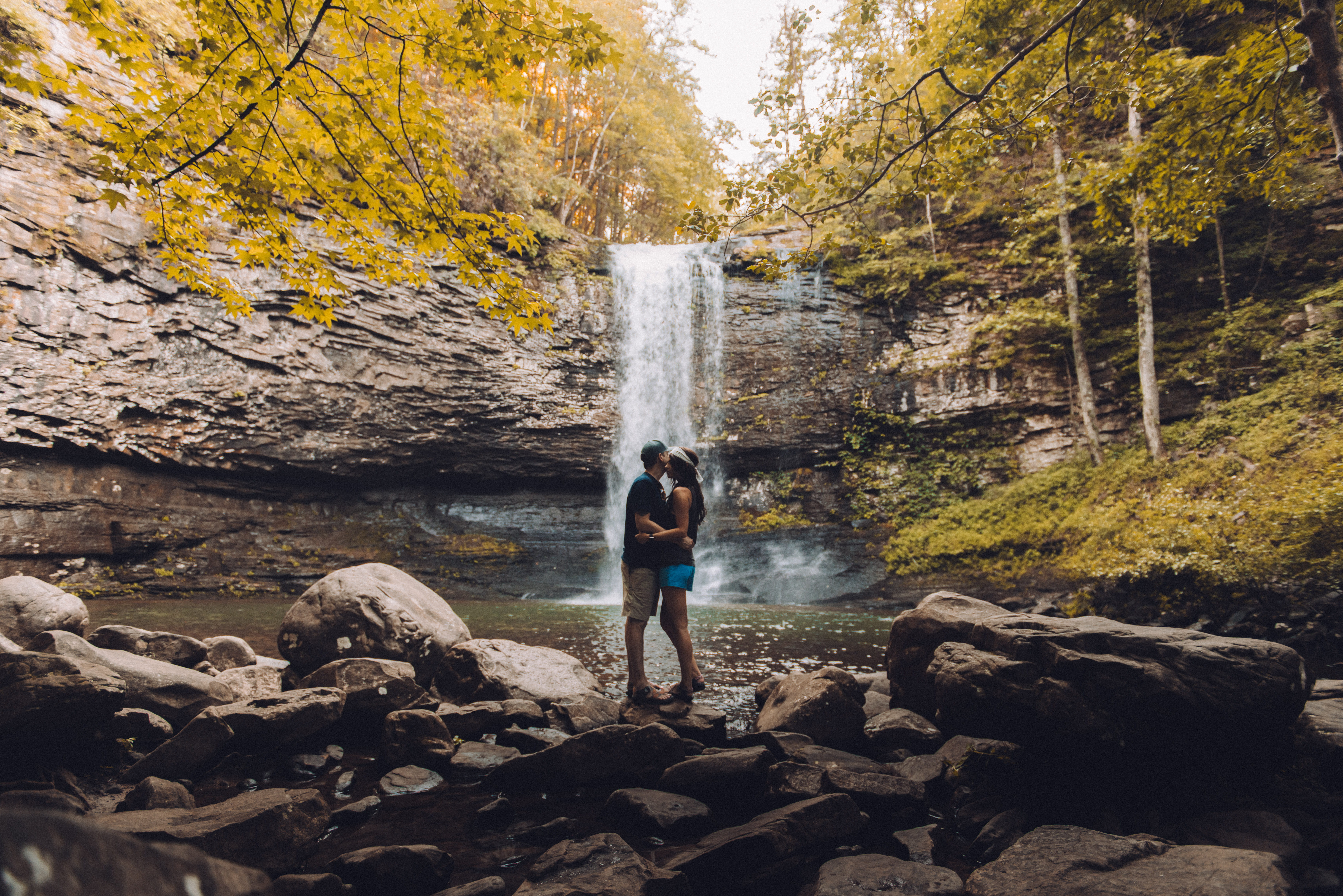 lifestyles, front, long exposure, real people, adult, rock, beauty in nature, outdoors, leisure activity, embrace, plant, 5K, nature, water, waterfall, HD Wallpaper