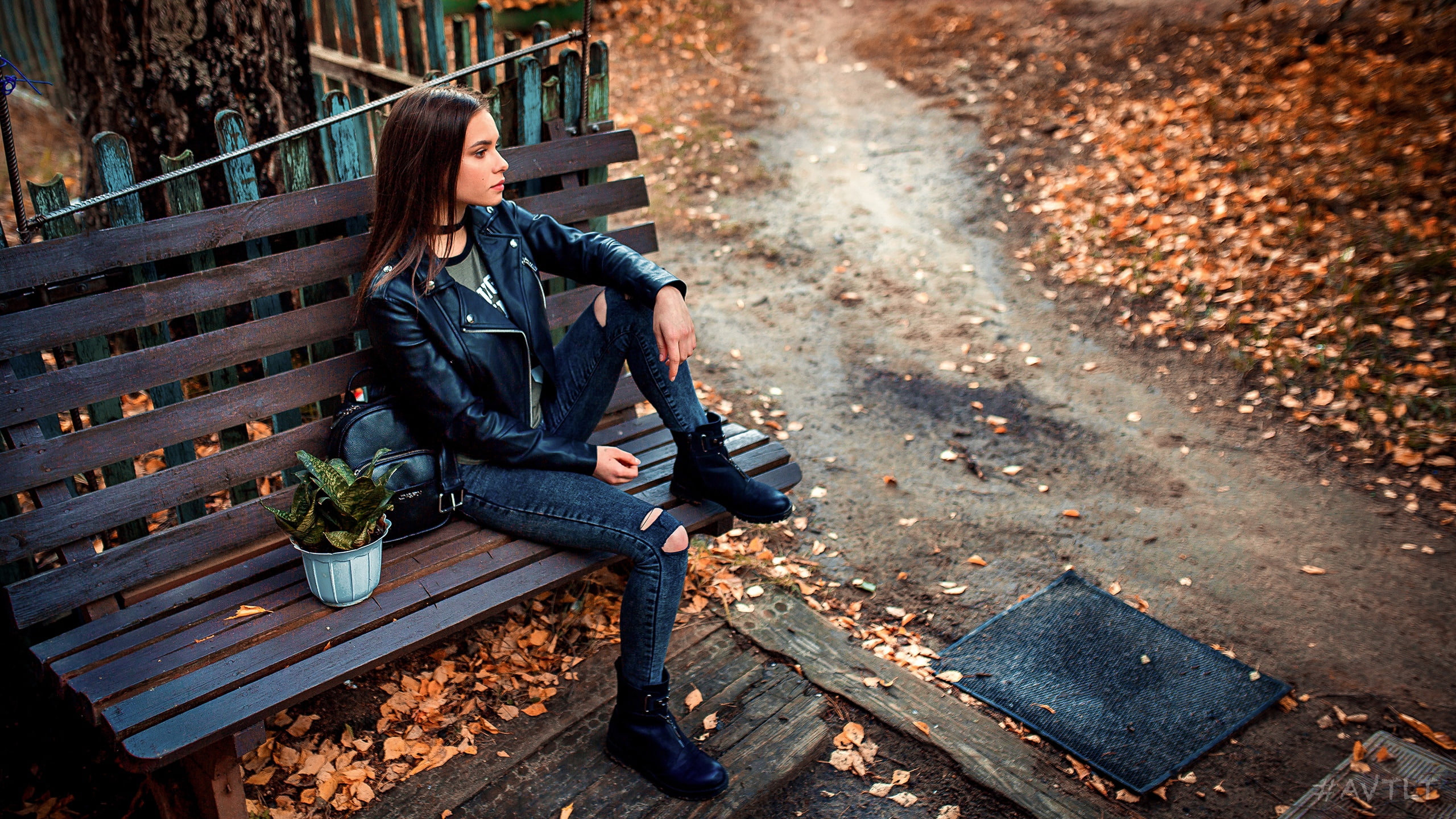 seat, fence, autumn, city, architecture, 2K, leather jacket, full length, necklace, looking into the distance, model, adult, women, casual clothing, black jackets, HD Wallpaper