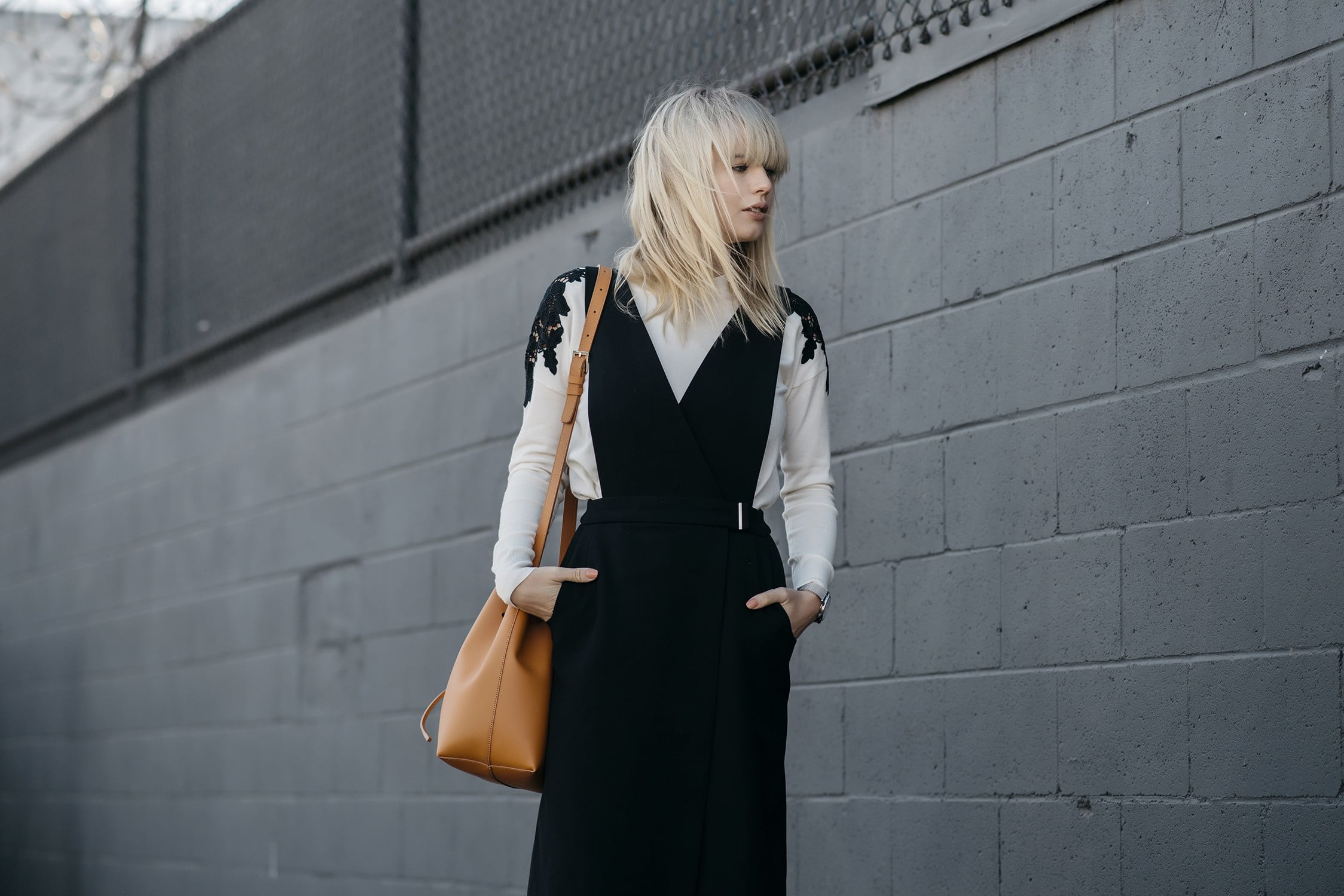 wall - building feature, contemplation, outdoors, standing, young women, blond hair, hands in pockets, women, Lisa Dengler, fashion, built structure, beauty, HD Wallpaper