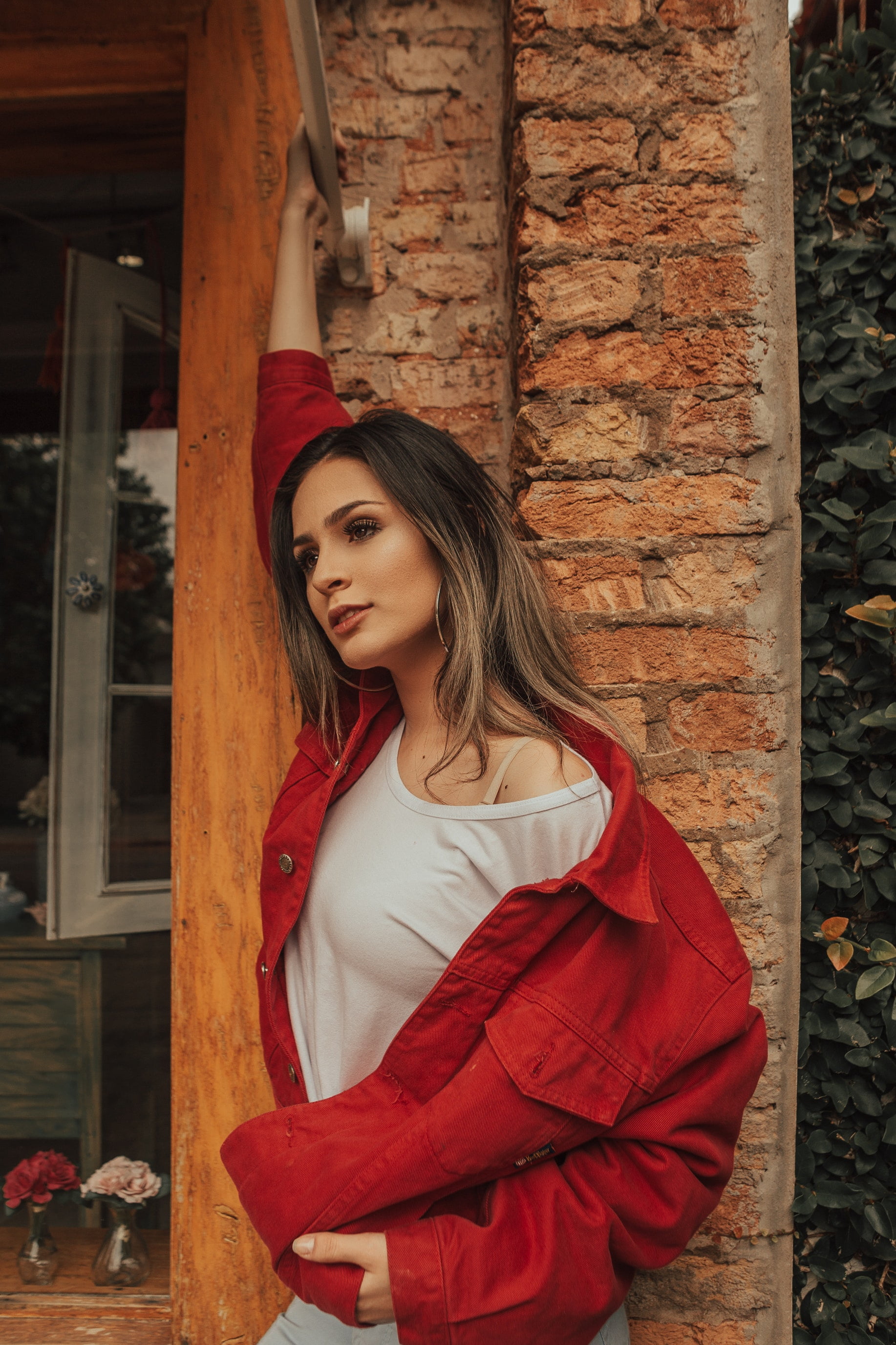 hoop earrings, beautiful woman, hairstyle, brick, clothing, brown eyes, young women, women outdoors, wall, open mouth, looking away, standing, fashion, Phone HD Wallpaper