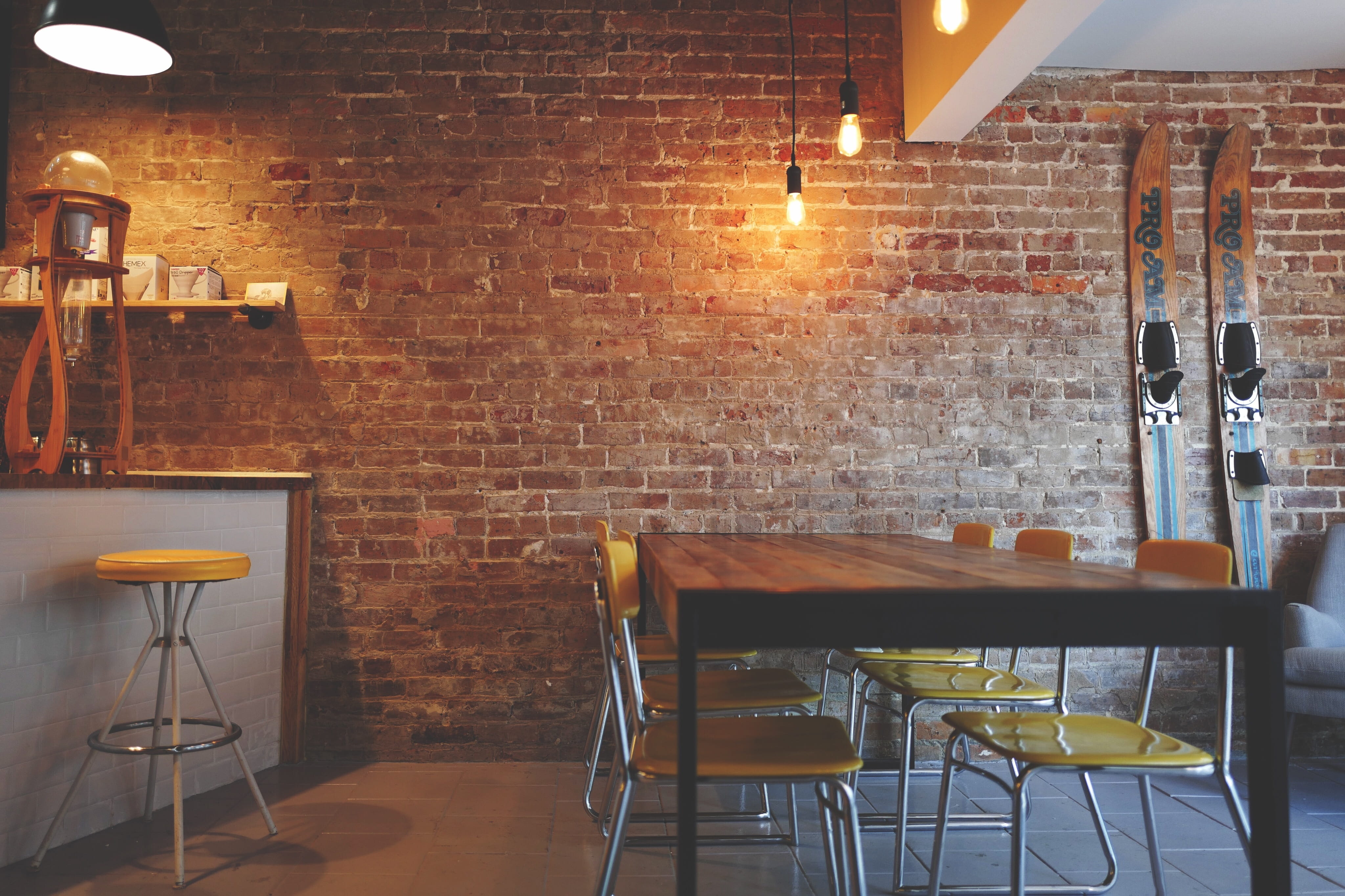 setting, business, yellow, absence, restaurant, wall, lighting equipment, chair, furniture, dining, brick wall, interior design, cafe, table, lights, illuminated, HD Wallpaper