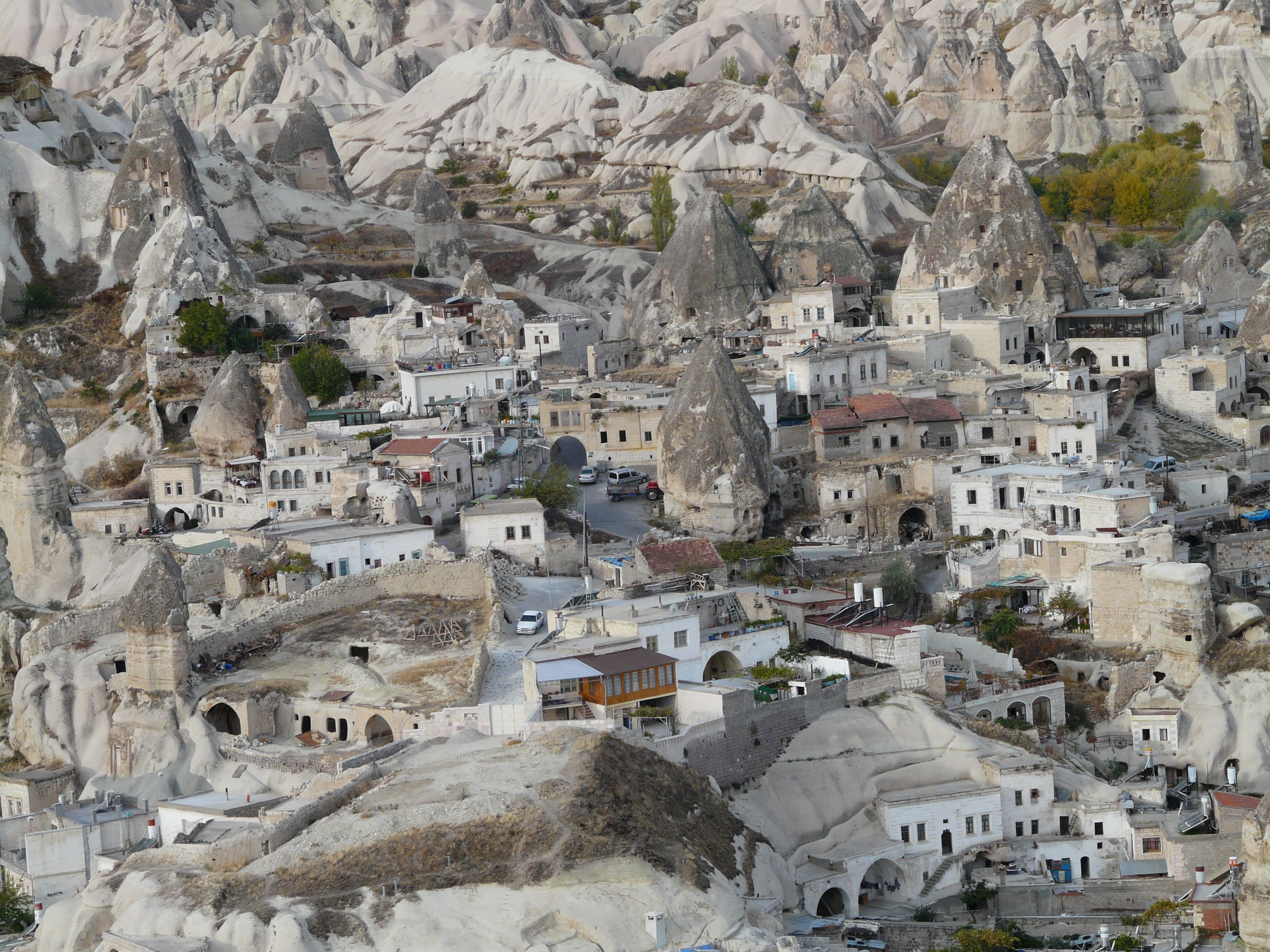 valley, place, 2K, mountain, tufa formations, house, concrete, townscape, aerial, building, rock formations, no people, fairy chimneys, tufa, architecture, HD Wallpaper