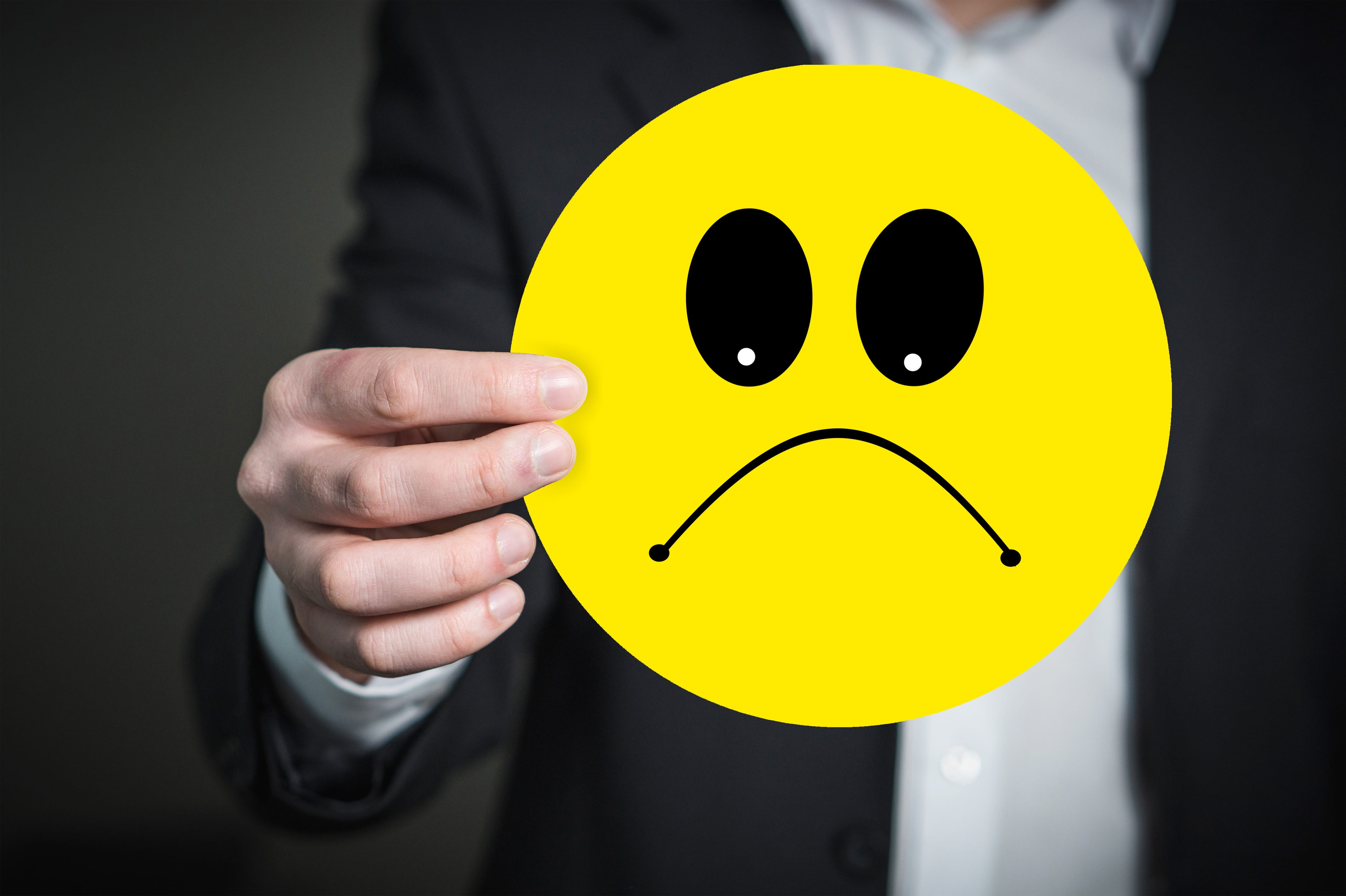smiling, bad mood, adult, close-up, body part, emotion, yellow, one person, holding, hand, males, smiley, businessman, anger, front view, human hand, anthropomorphic smiley face, HD Wallpaper