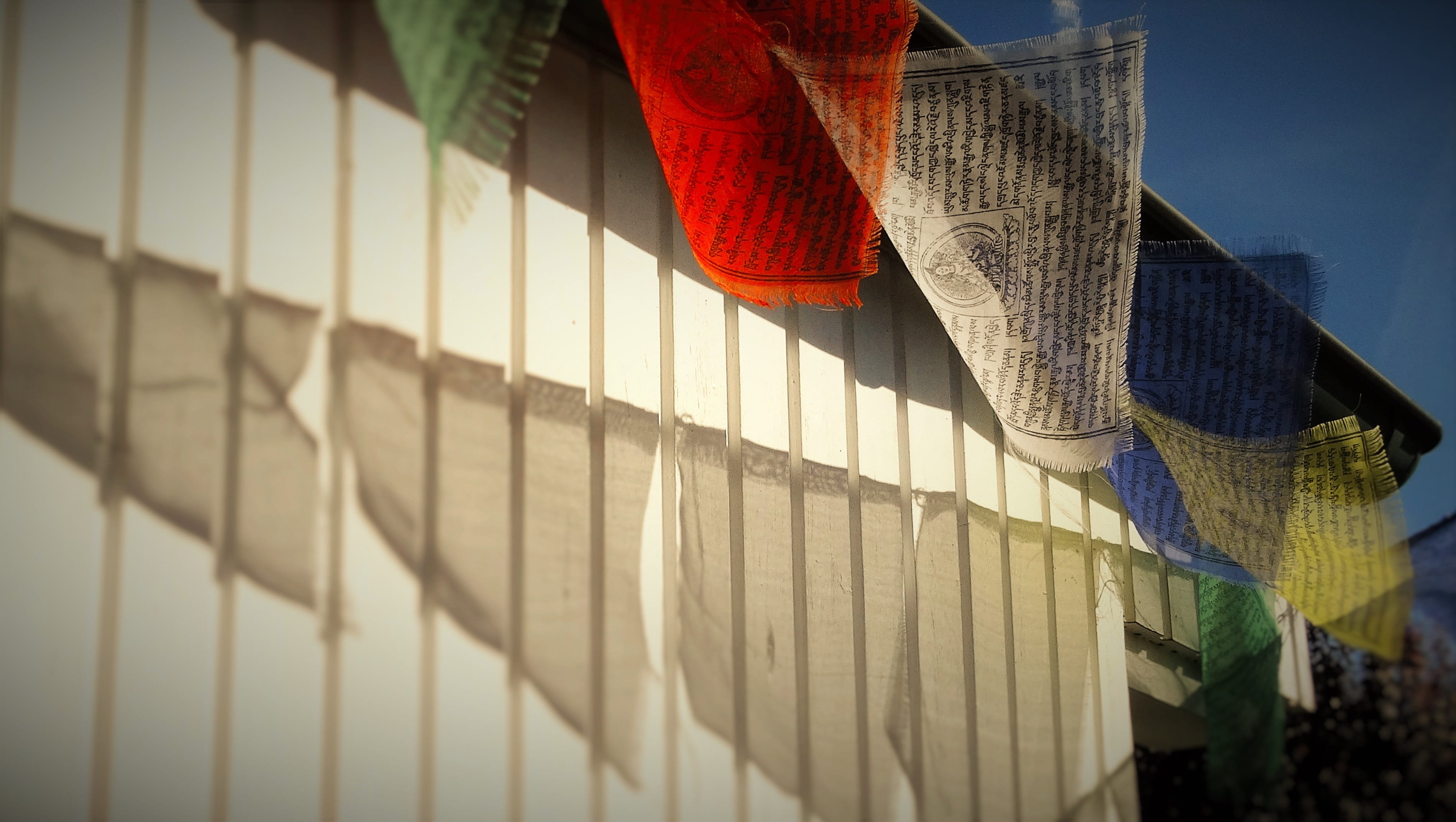 sunlight, Tibetan, Prayer Flags, building, sky, textile, outdoors, Buddhism, city, built structure, day, nature, red, no people, event, 2K, architecture, HD Wallpaper