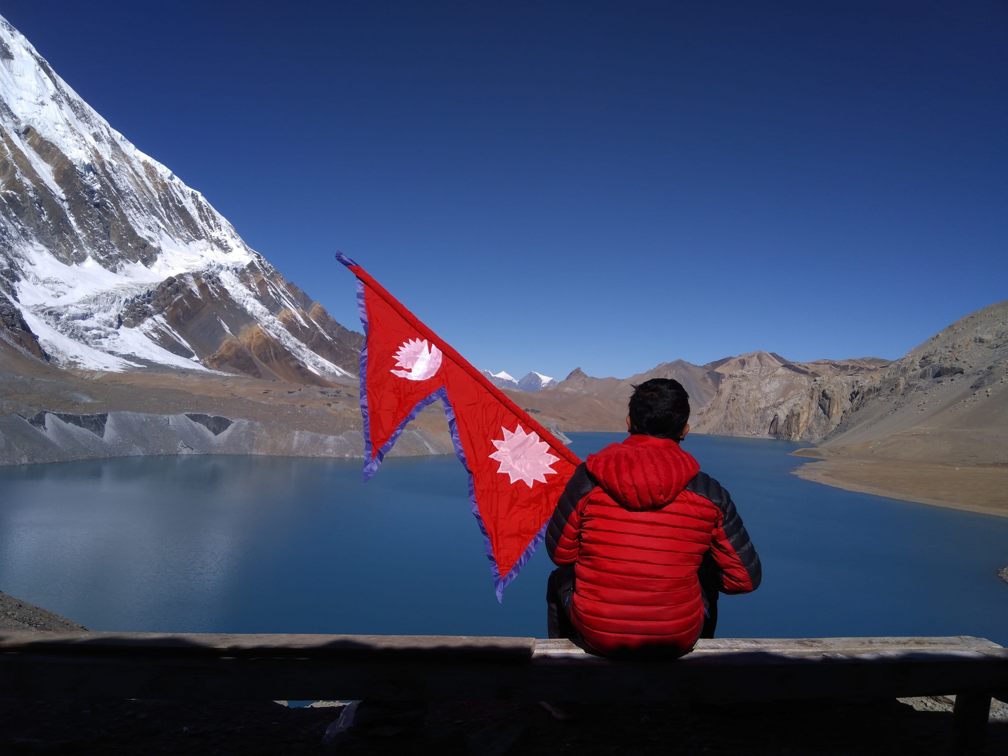 beauty in nature, himal, sitting, patriotism, winter, one person, man, outdoors, environment, rear view, tilicho, red, lake, nepal, scenics - nature, fresh, HD Wallpaper