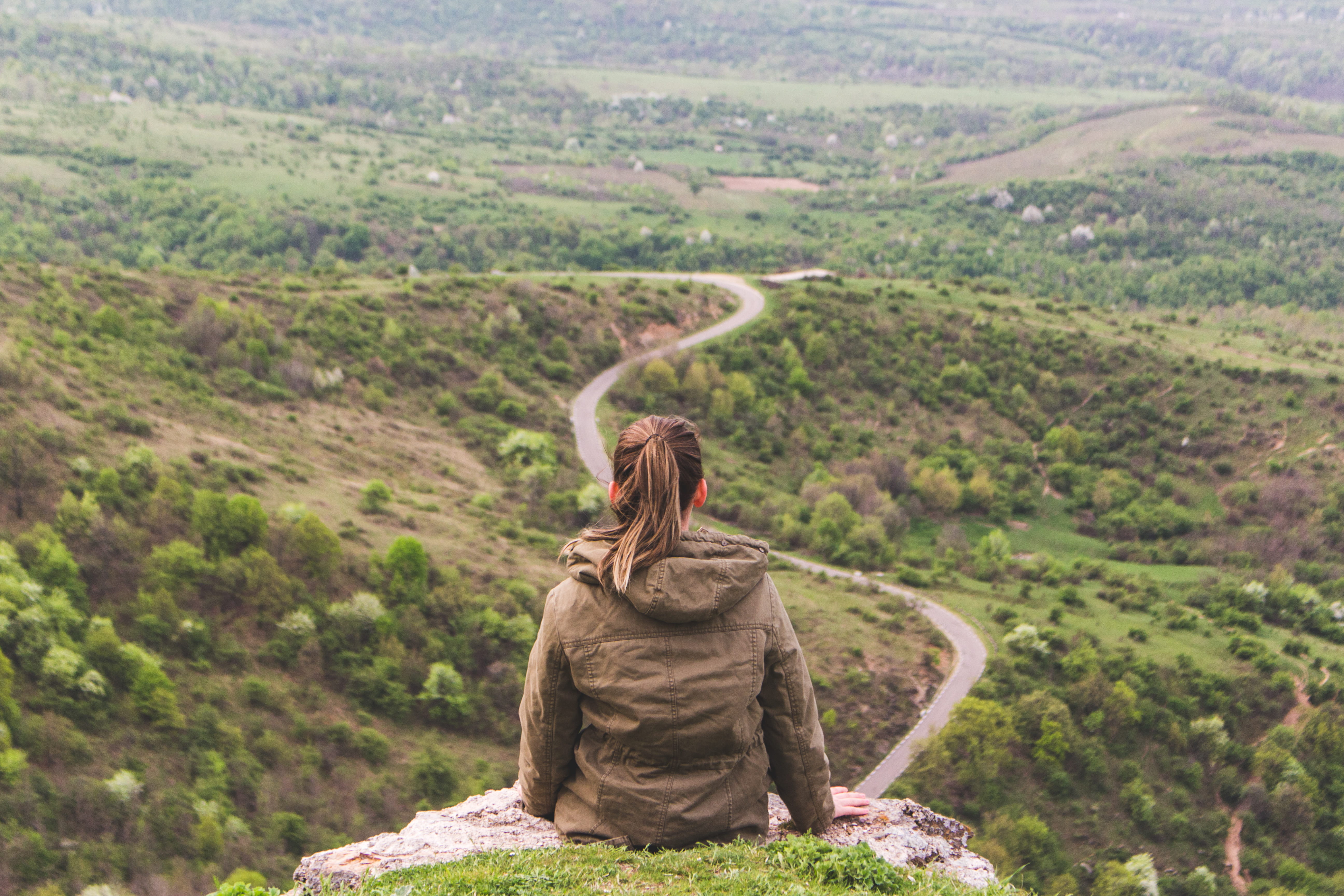 path, sit, women, land, road, rear view, rock, one person, green color, wanderlust, scenics - nature, grey, trek, tranquility, woman, hairstyle, nature, HD Wallpaper
