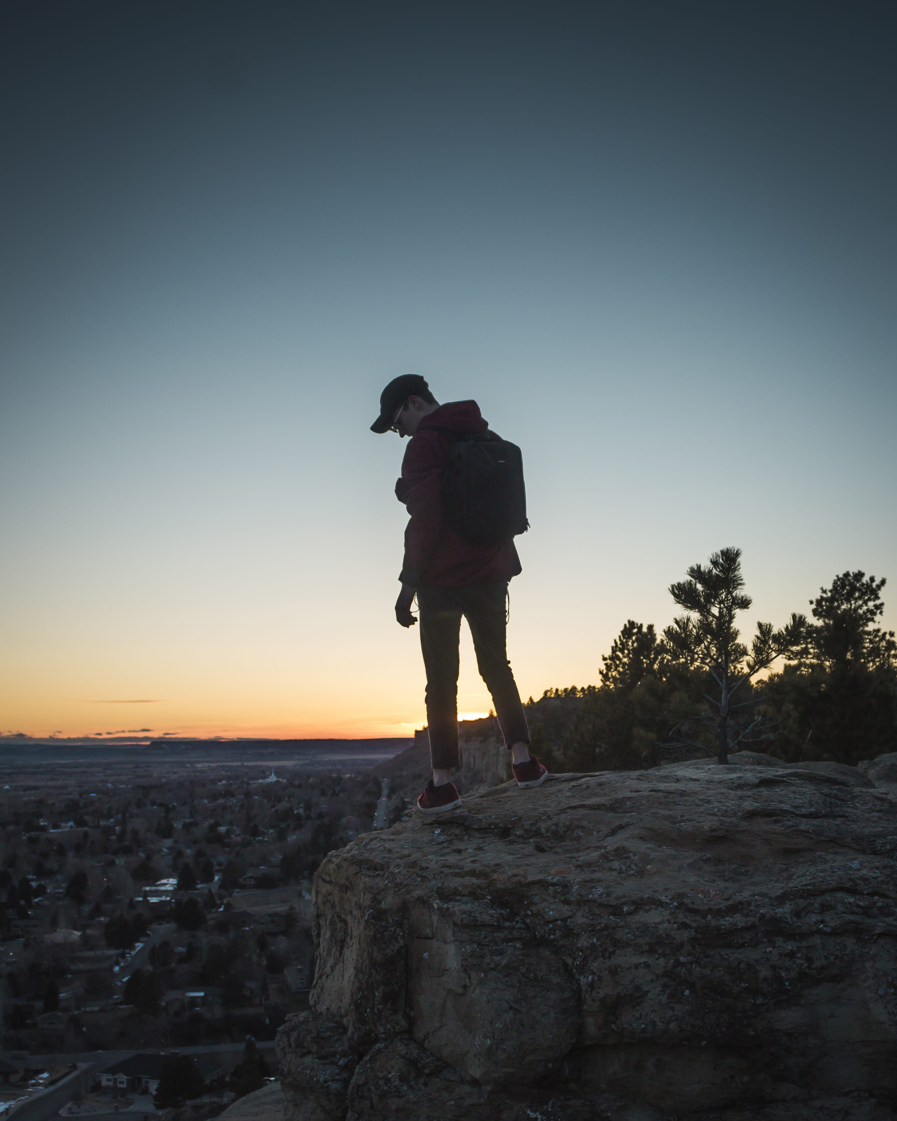 2K, sky, real people, silhouette, clear sky, montana, lifestyles, guy, rear view, rock, tranquility, one person, beauty in nature, standing, copy space, Phone HD Wallpaper