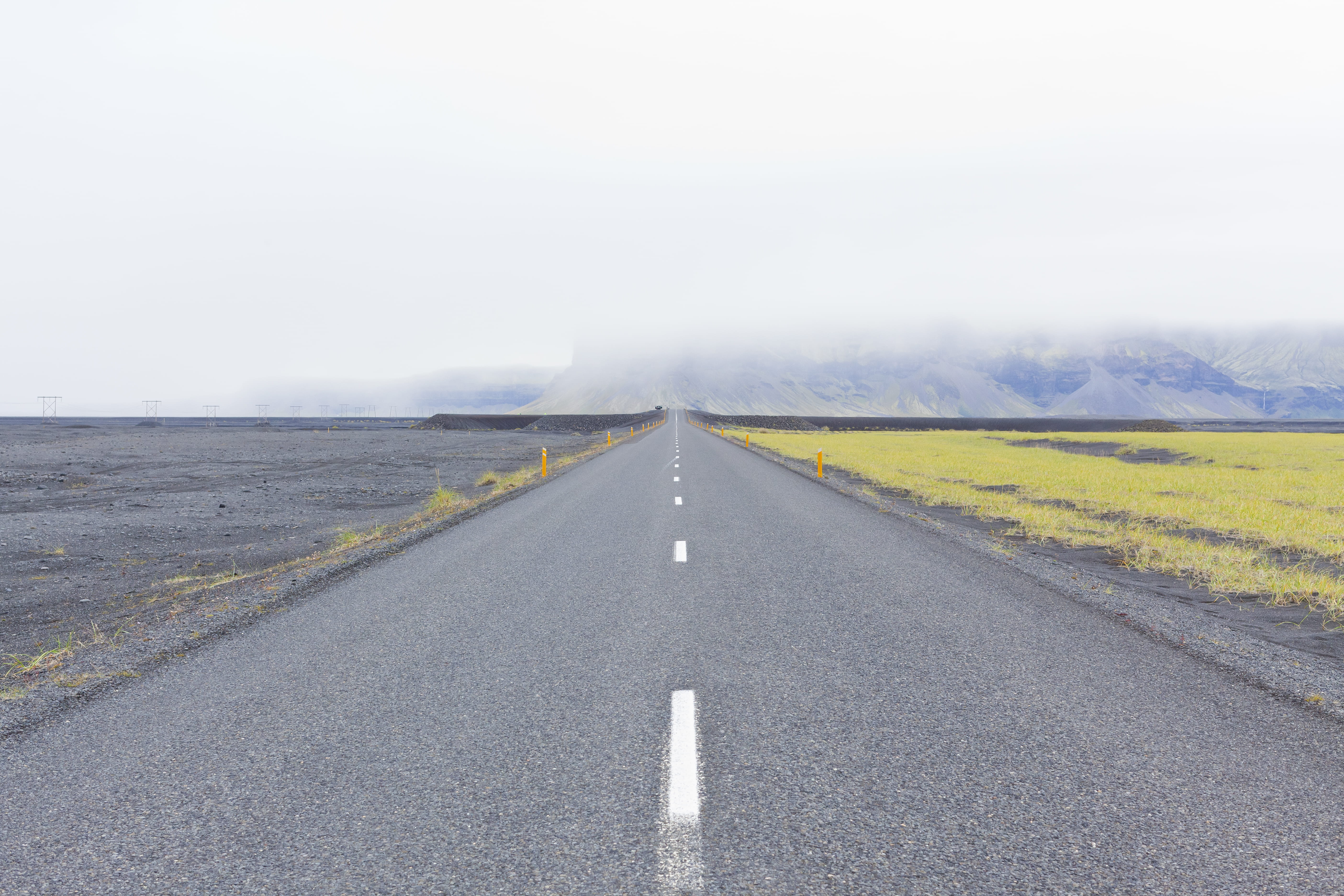 islandia, non-urban scene, asphalt, dividing line, no people, vanishing point, transportation, sign, diminishing perspective, marking, mountain, the way forward, HD Wallpaper