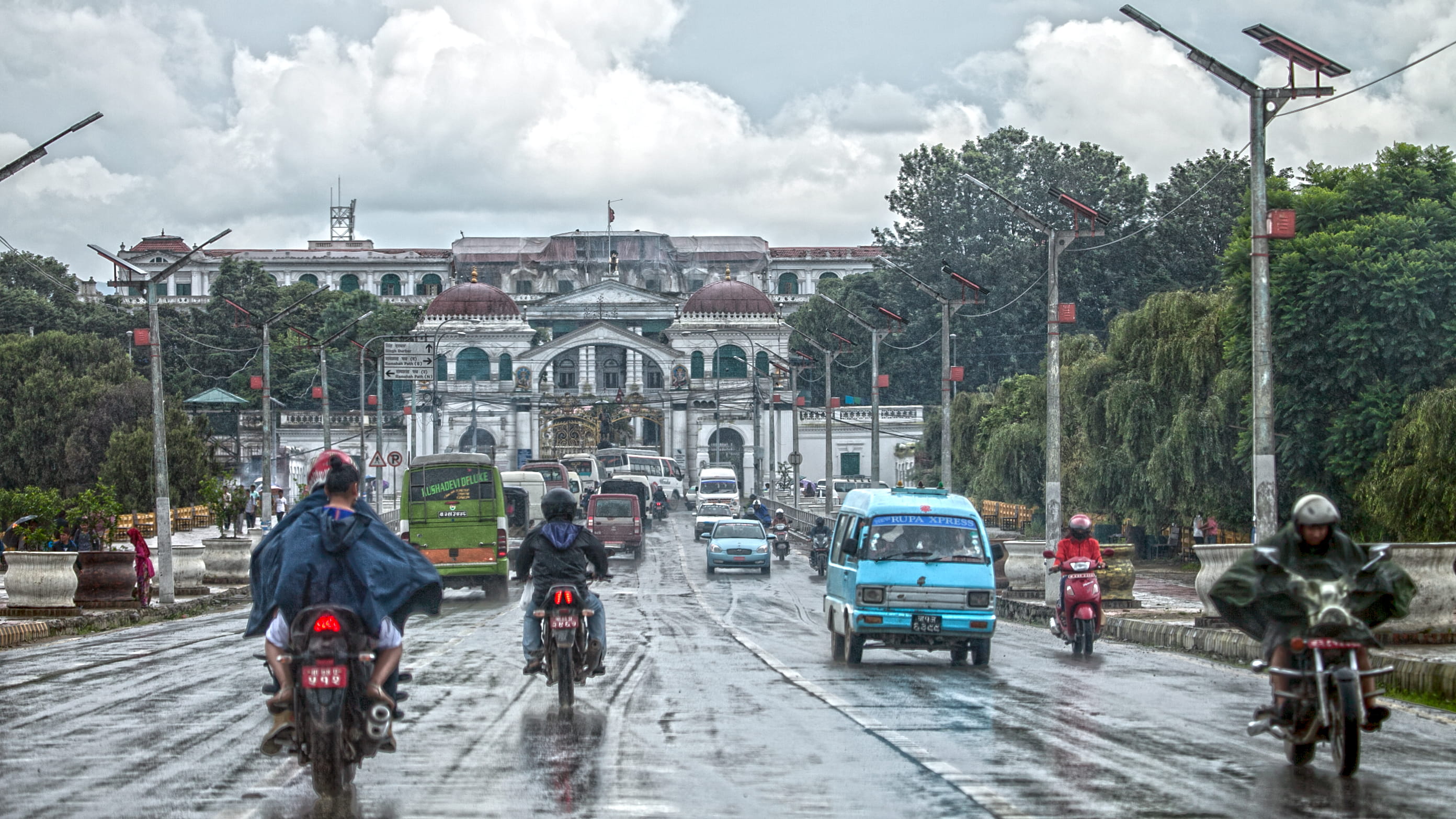 city, building, rain, 2K, transportation, travel, building exterior, land vehicle, real people, sky, outdoors, kathmandu, women, lifestyles, street, road, HD Wallpaper