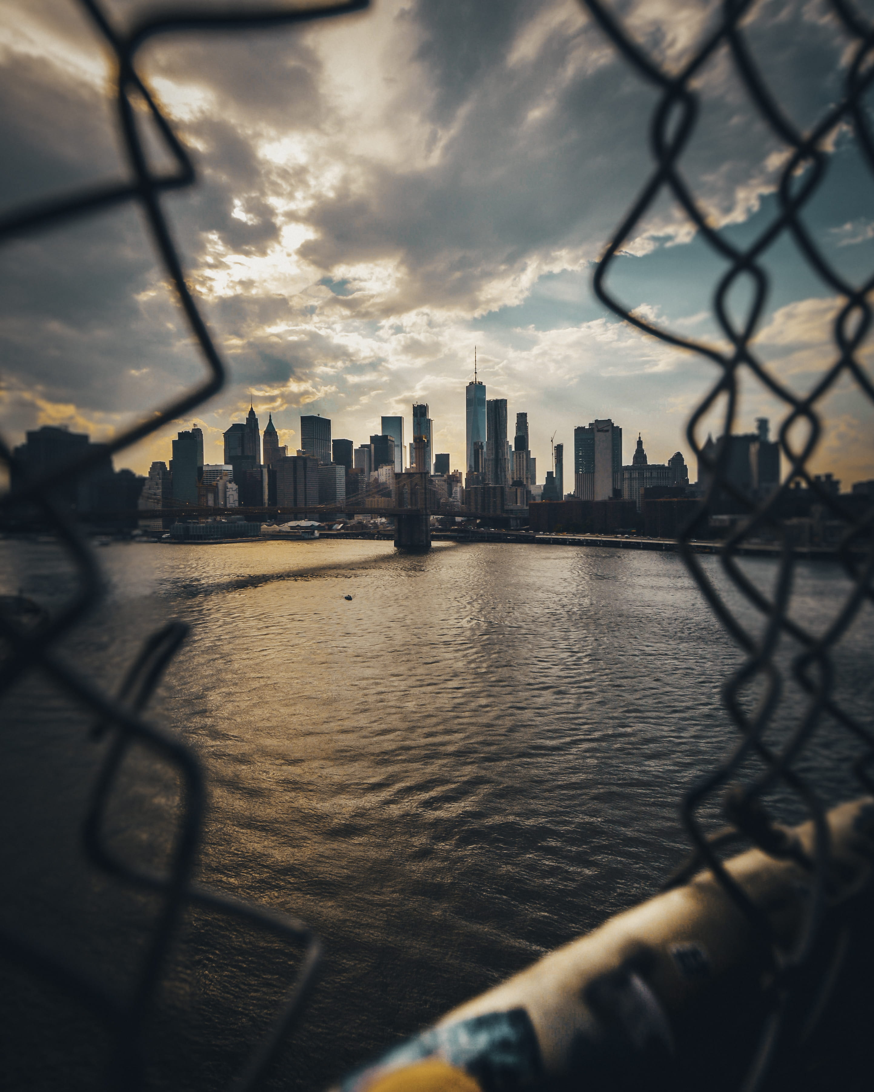 outdoors, showing, chainlink fence, sunset, skyscraper, android, cityscape, cloud - sky, gray, financial district, skyline, built structure, Phone HD Wallpaper