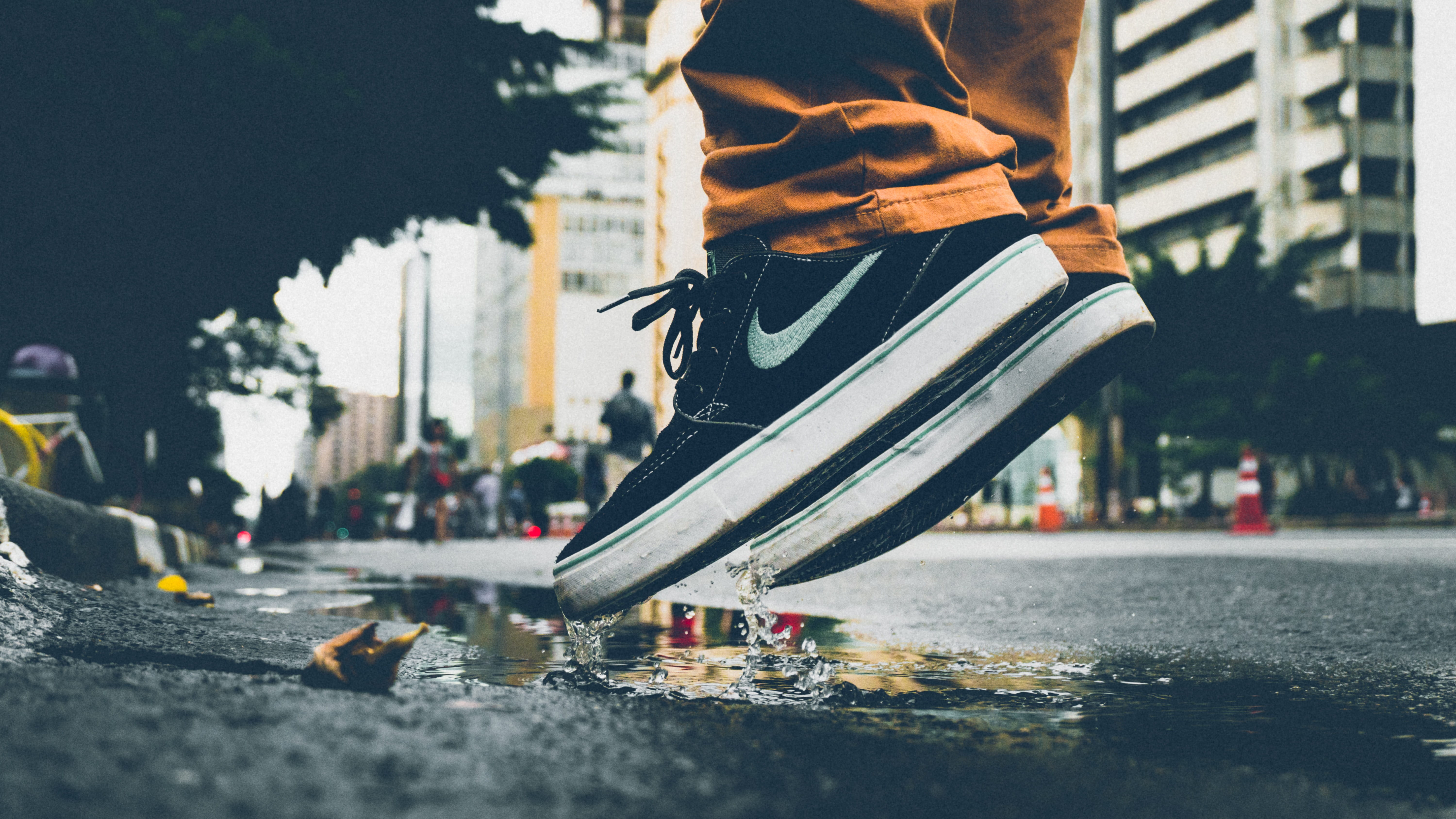 built structure, city, adult, body part, jumping, human leg, human limb, people, day, city street, person, shoes, road, nike, outdoors, limb, lifestyles, HD Wallpaper