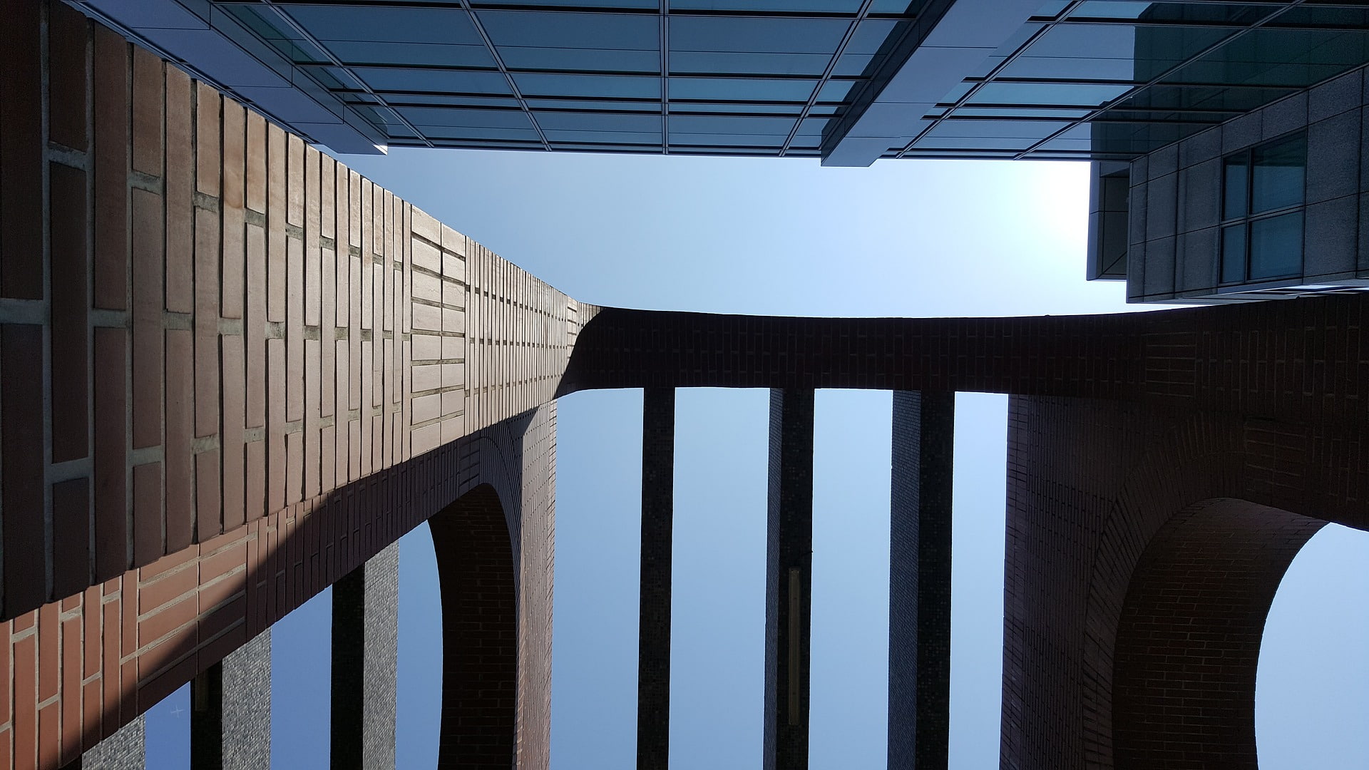 directly below, no people, office building exterior, pattern, bricks, 1080P, building, skyscraper, arch, office, shadow, window, sky, built structure, HD Wallpaper