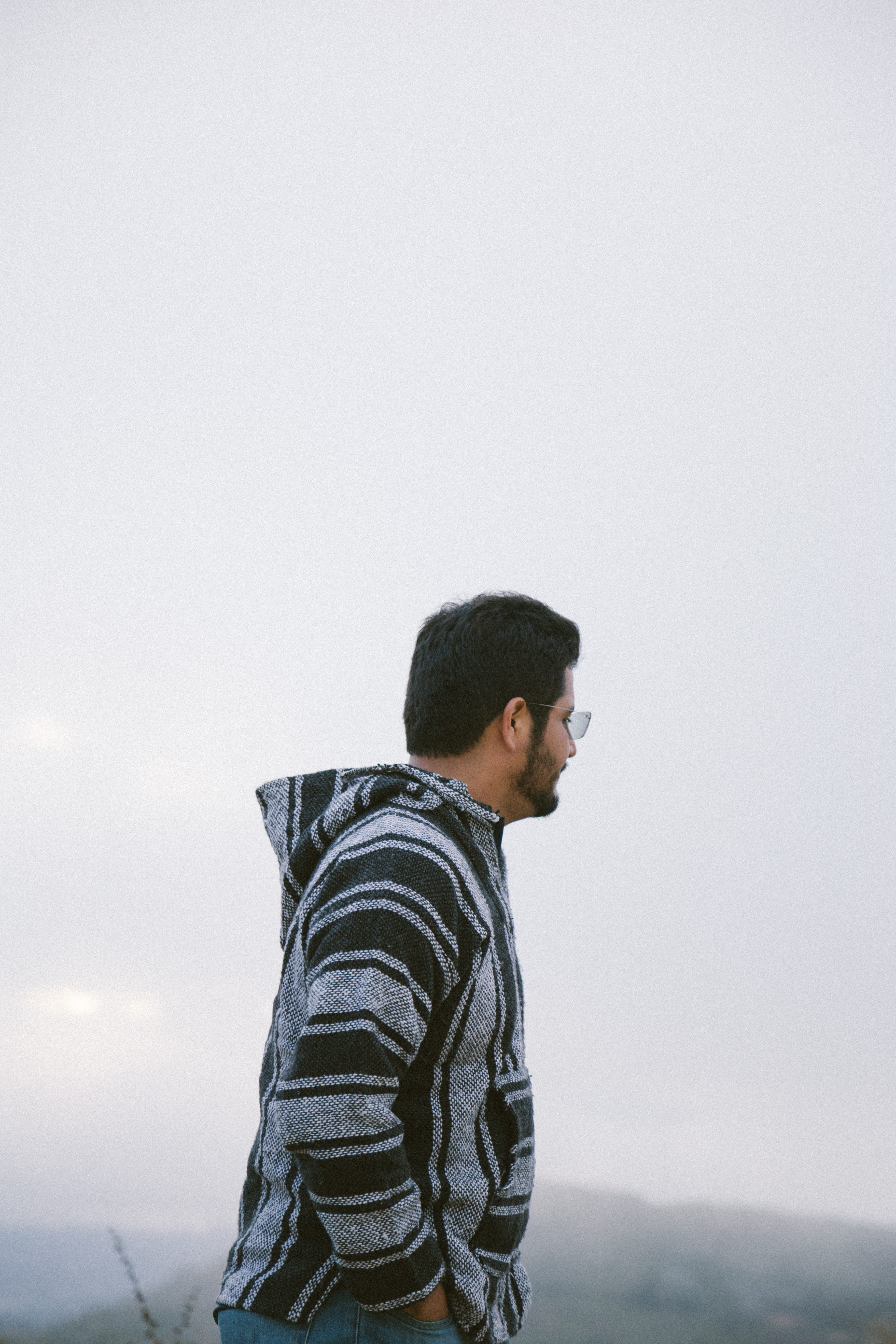 apparel, alone, casual clothing, sweater, t-shirt, wearing, real people, young men, standing, profile view, outdoors, loneliness, person, jacket, black, Phone HD Wallpaper